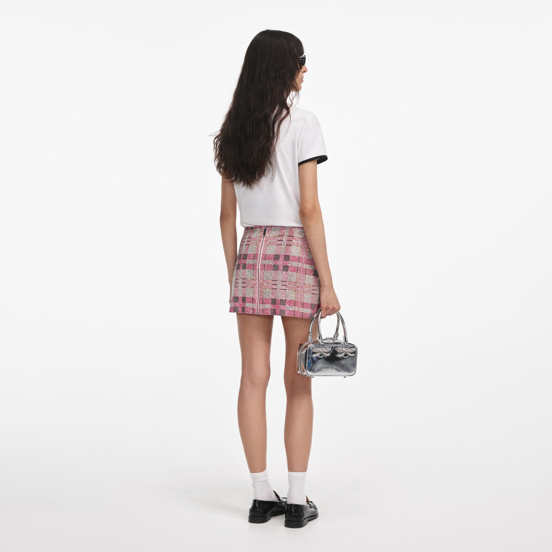 Back view of a woman wearing the White T-Shirt With Embroidered Logo