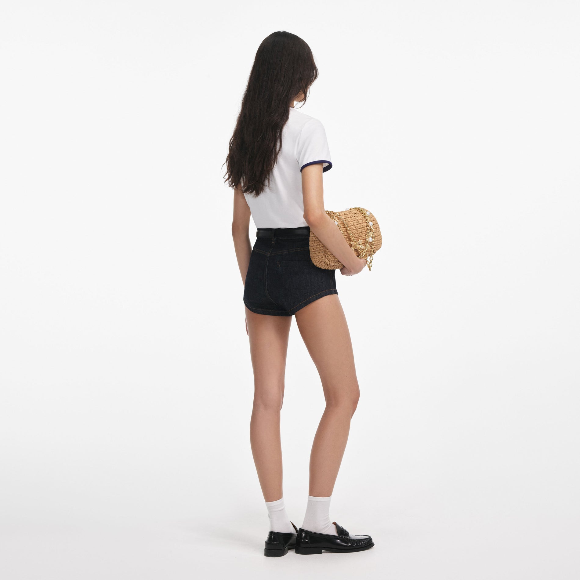 Back view of a woman wearing the White T-Shirt With Pink Logo