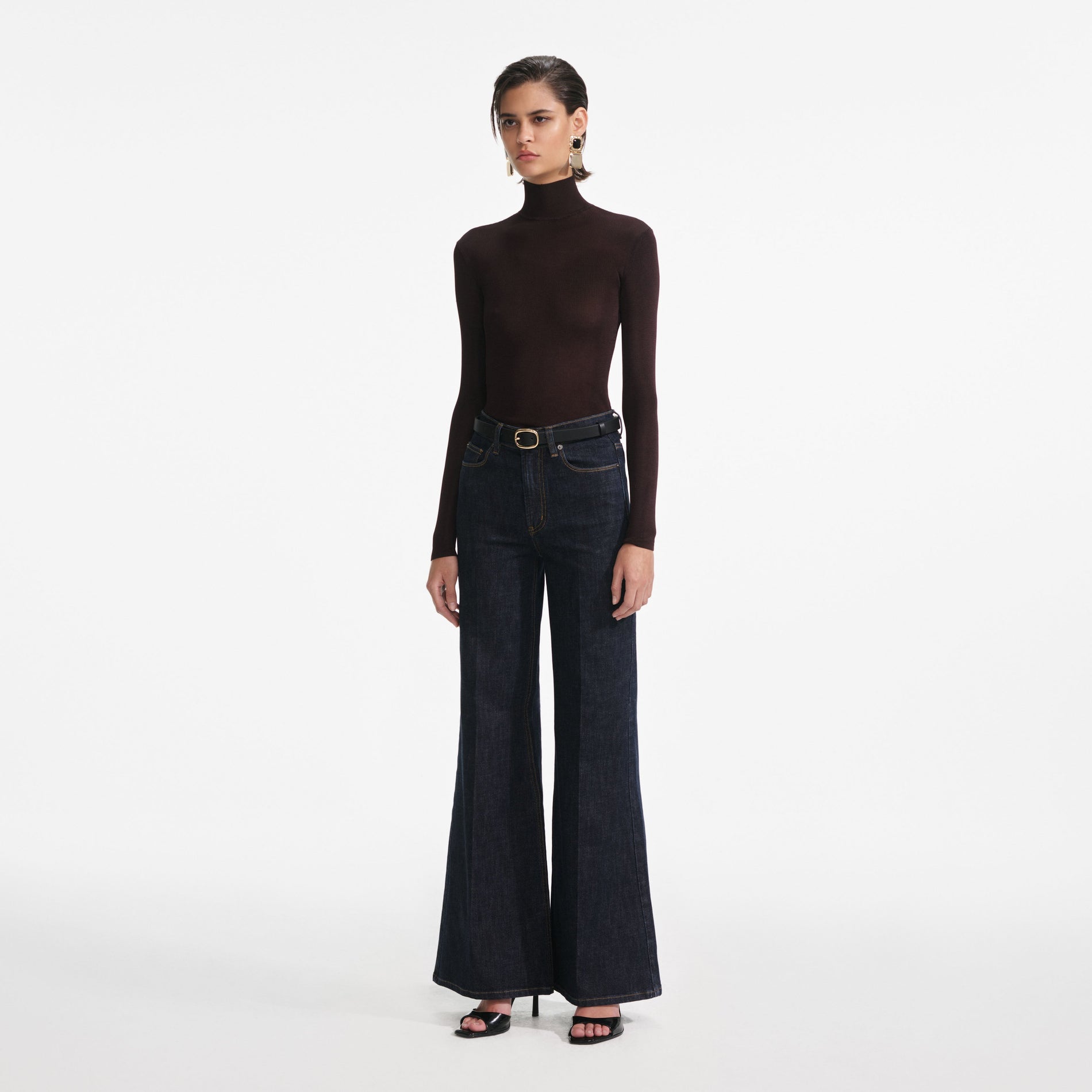 Side view of a woman wearing the Brown Viscose Knit Top