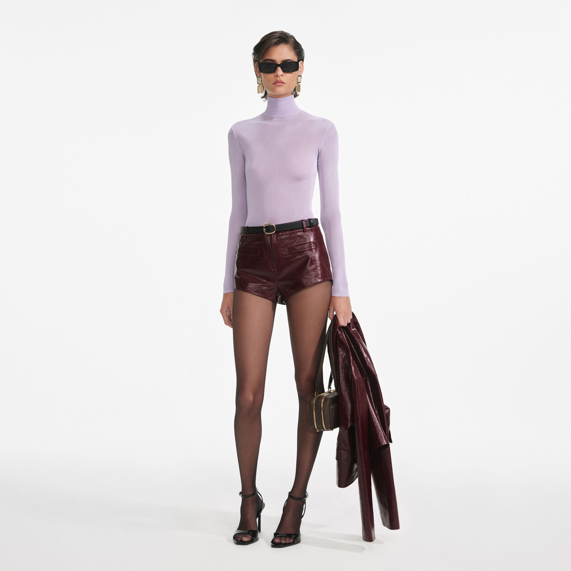 Side view of a woman wearing the Lilac Viscose Knit Top