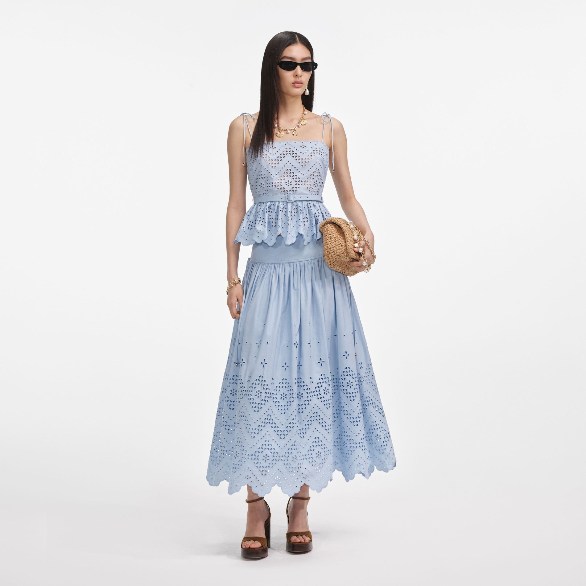 Front view of a woman wearing the Blue Cotton Broderie Top