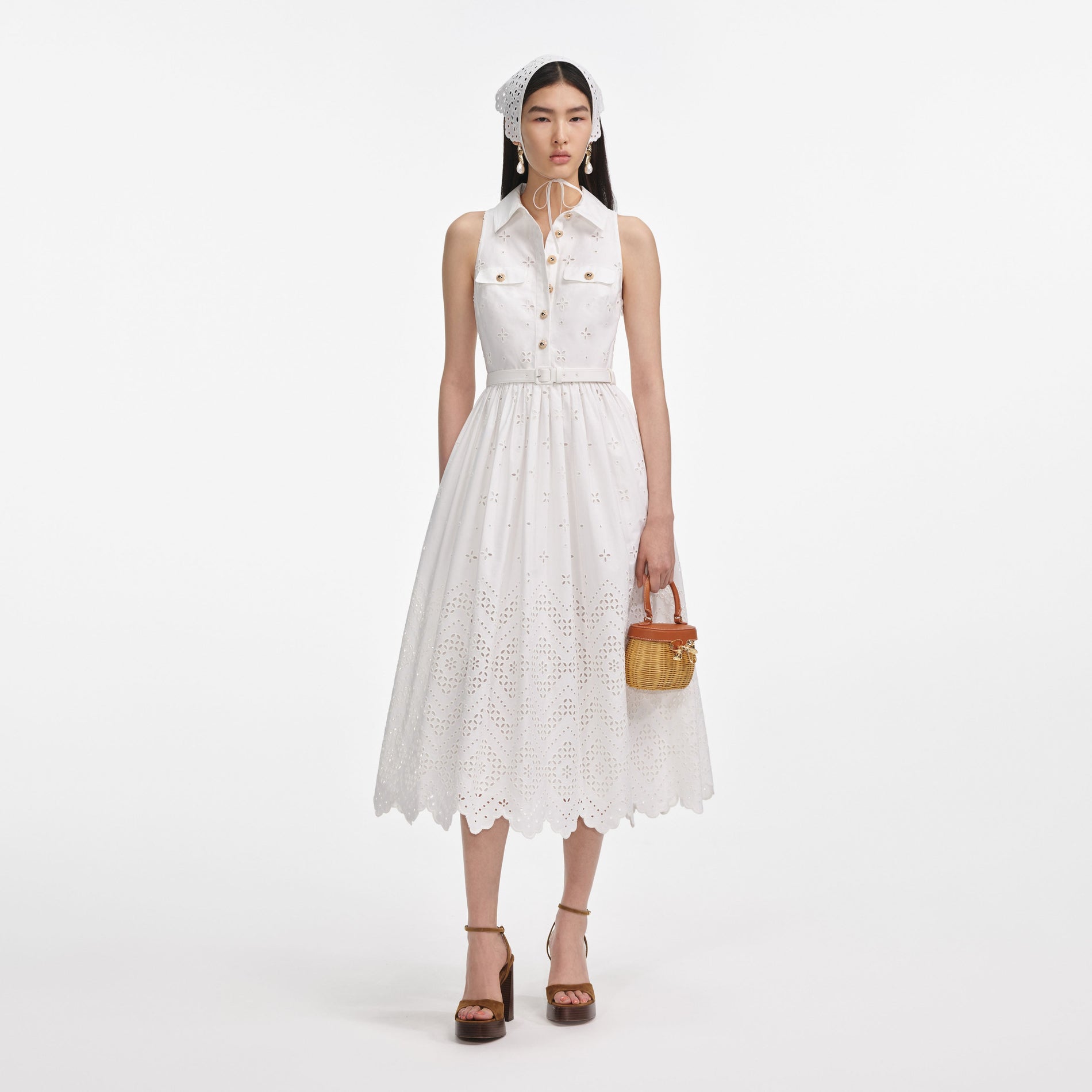 Front view of a woman wearing the White Cotton Broderie Collared Midi Dress