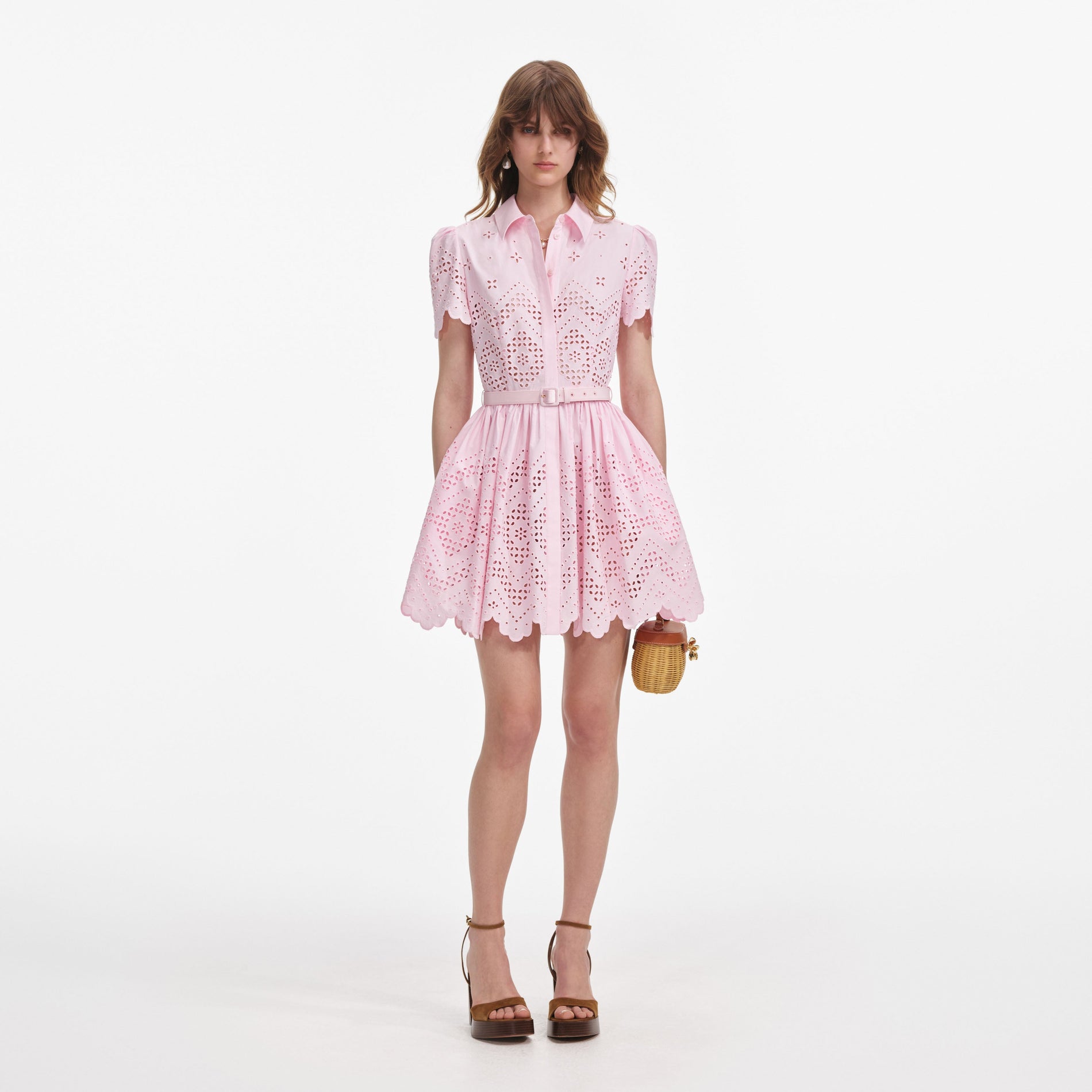 Front view of a woman wearing the Pink Cotton Broderie Mini Dress