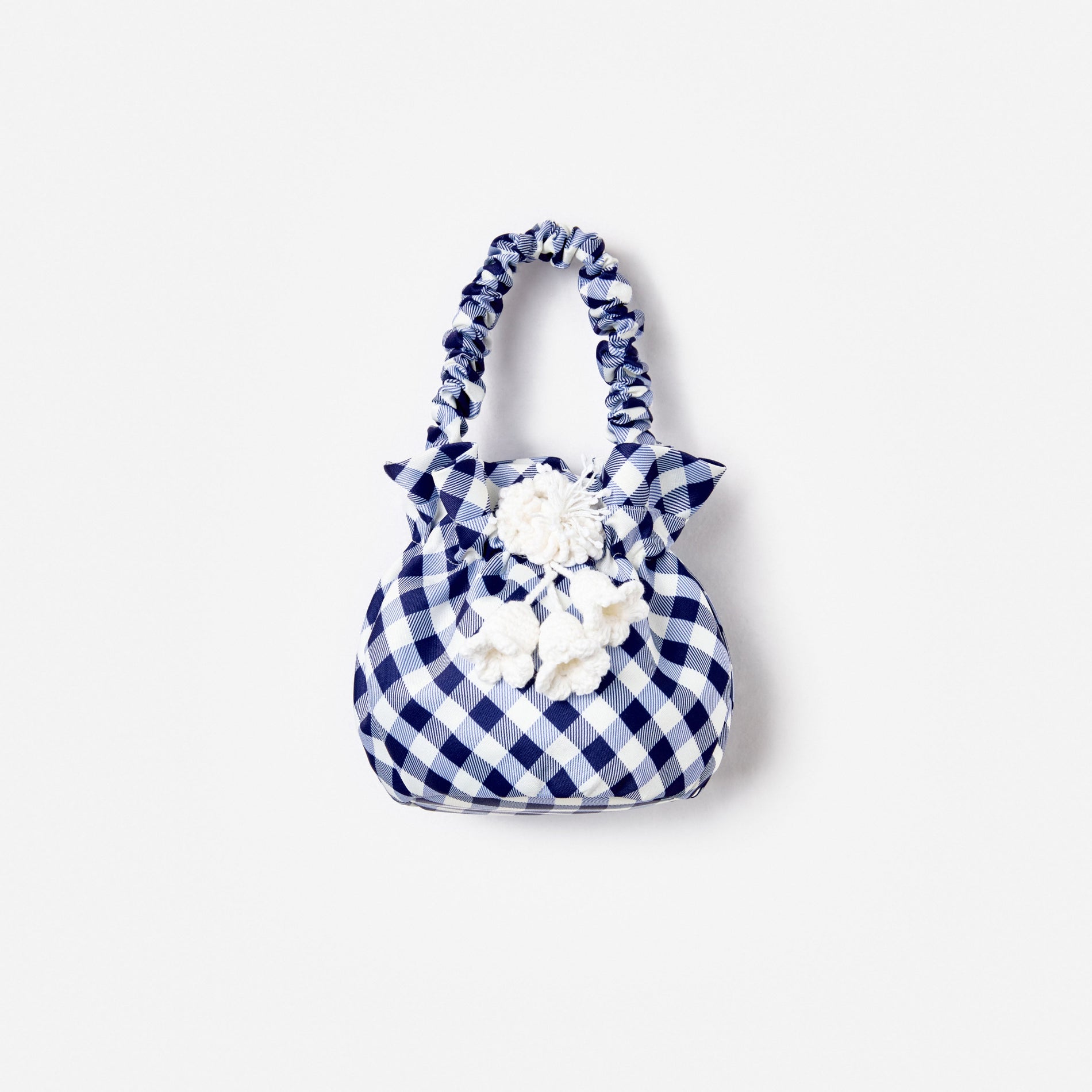 Blue and white gingham handbag with ruched handle and white crochet flower details