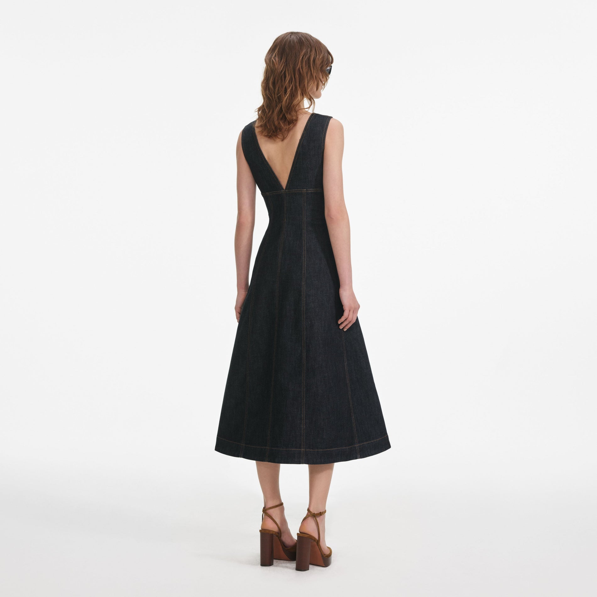 Back view of a woman wearing the Indigo Denim Midi Dress