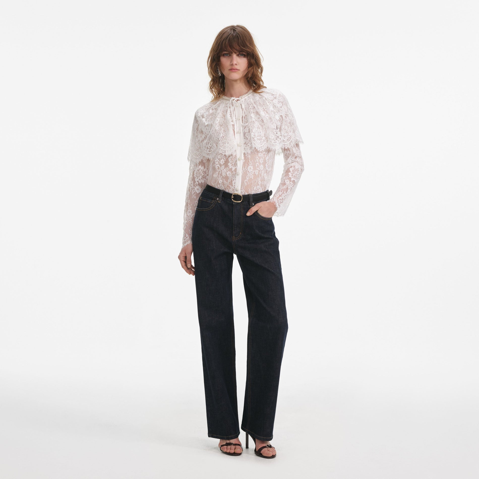 Front view of a woman wearing the Indigo Straight Leg Jeans