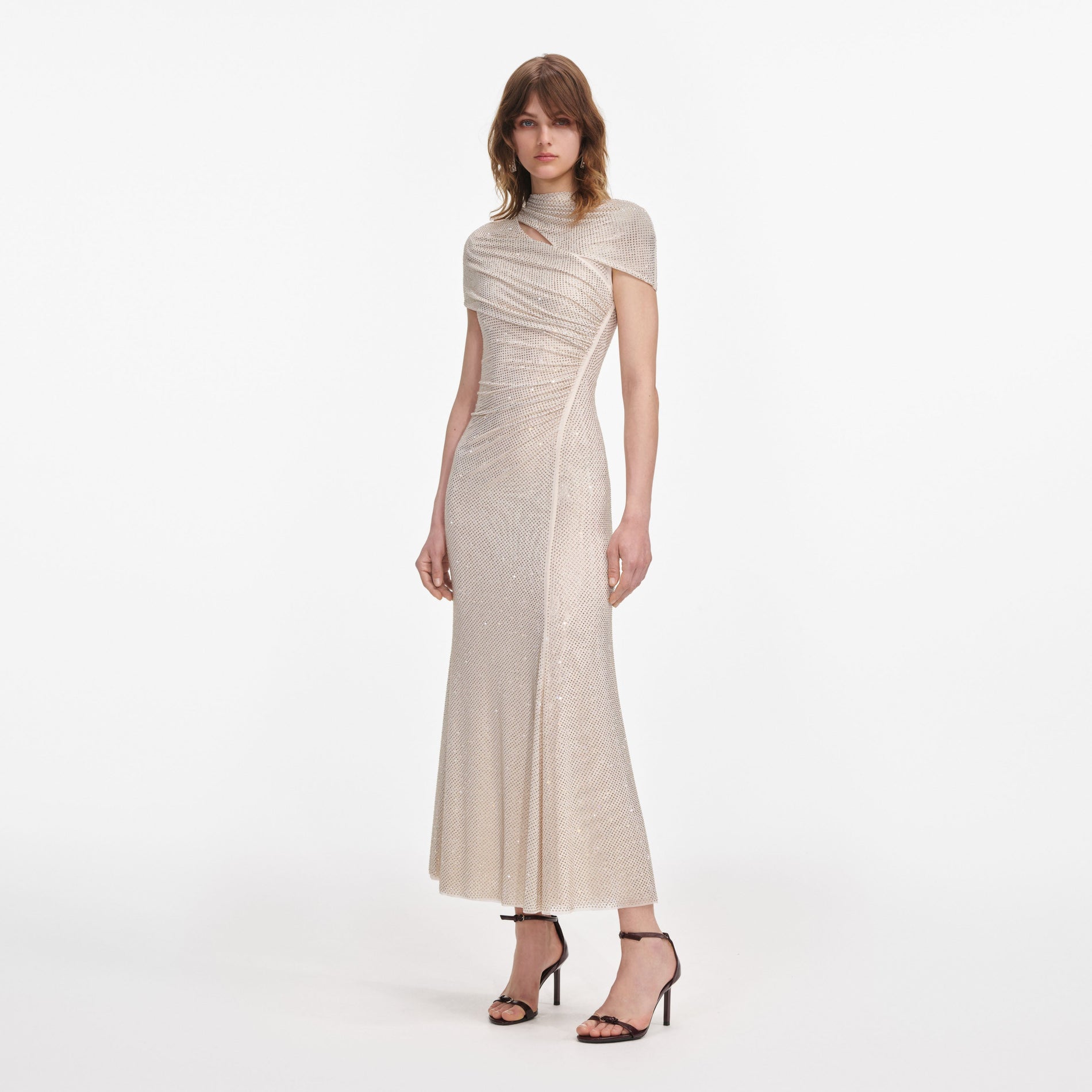 Side view of a woman wearing the Champagne Rhinestone Mesh Cut Out Midi Dress