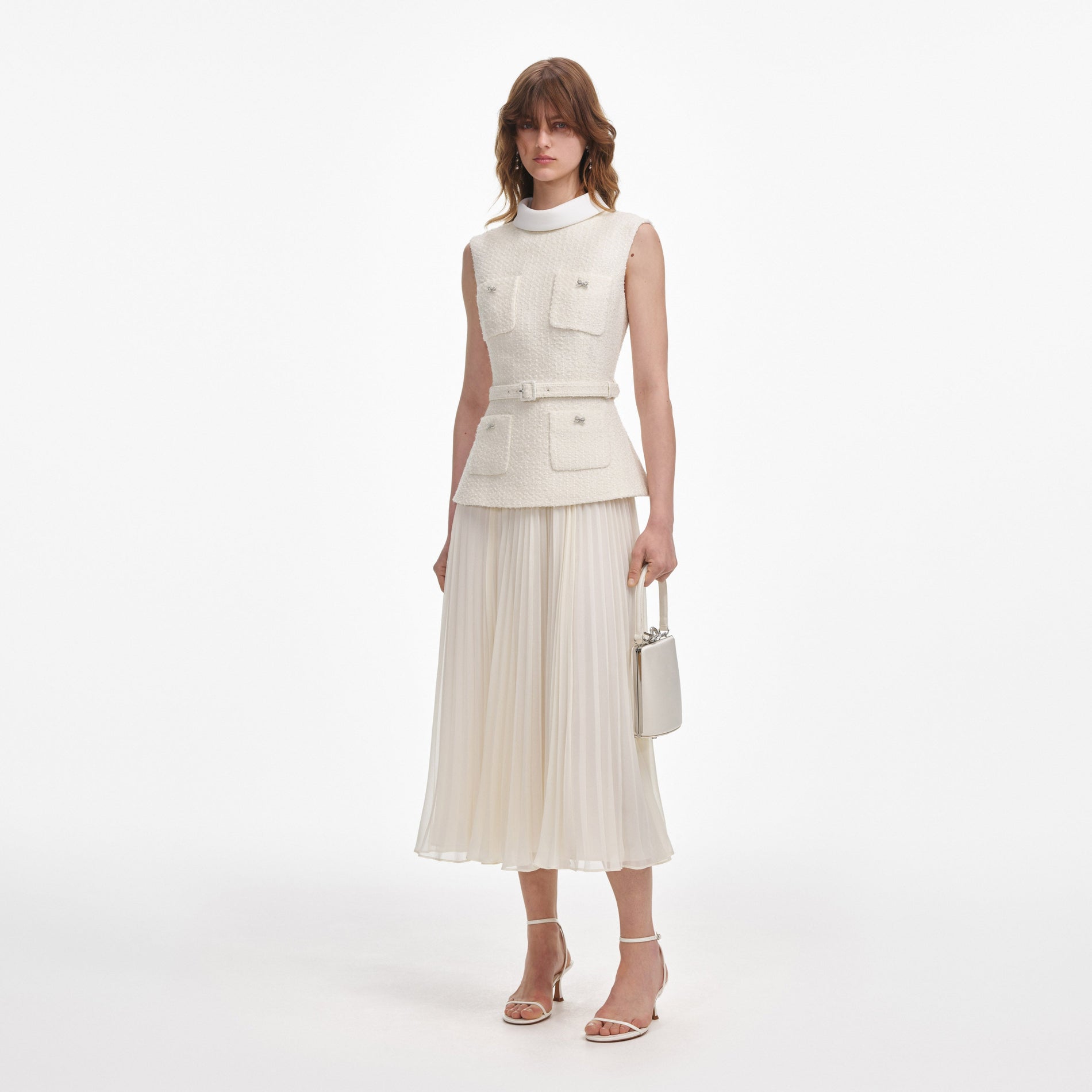 Side view of a woman wearing the Cream Boucle Sleeveless Midi Dress