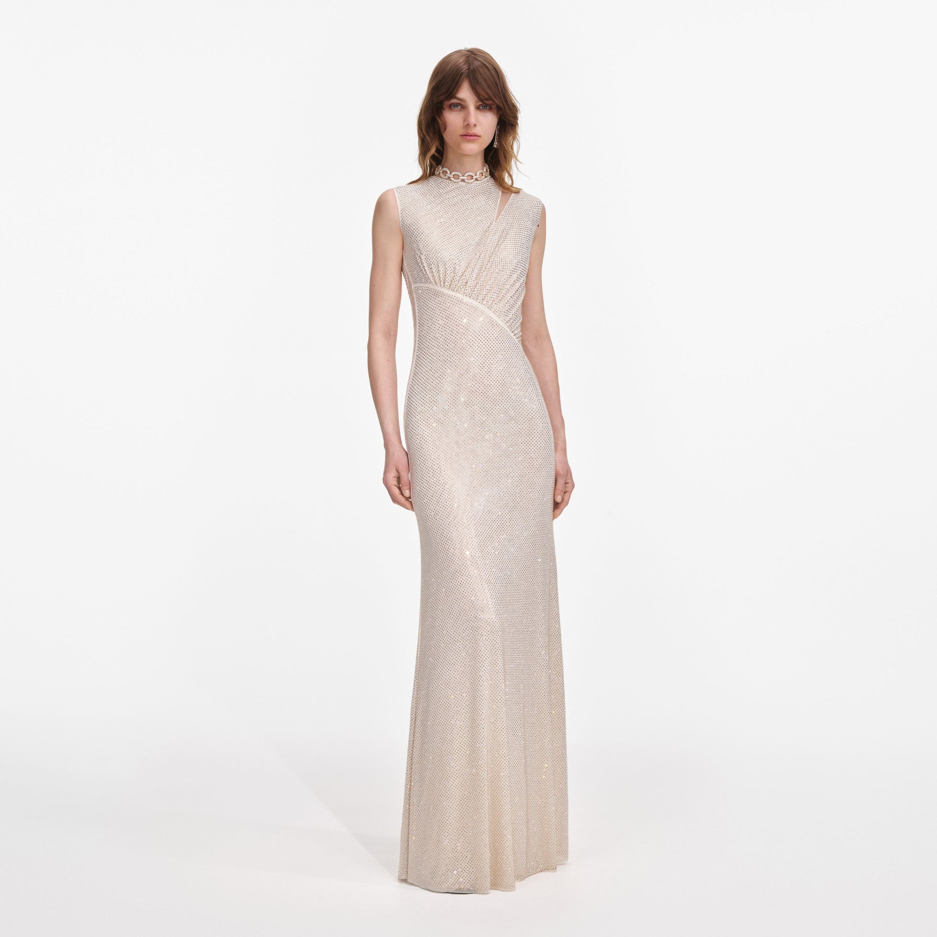Front view of a woman wearing the Champagne Rhinestone Cut Out Maxi Dress