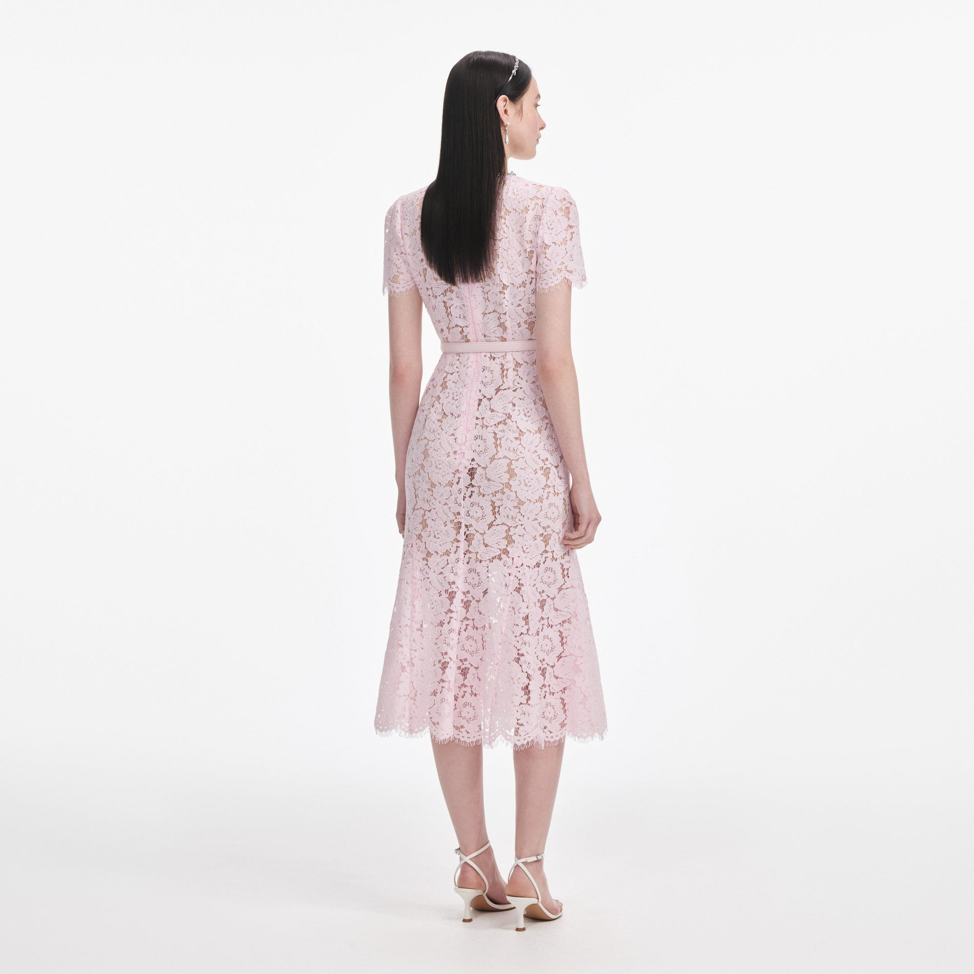 Back view of a woman wearing the Pink Lace Bow Trim Midi Dress