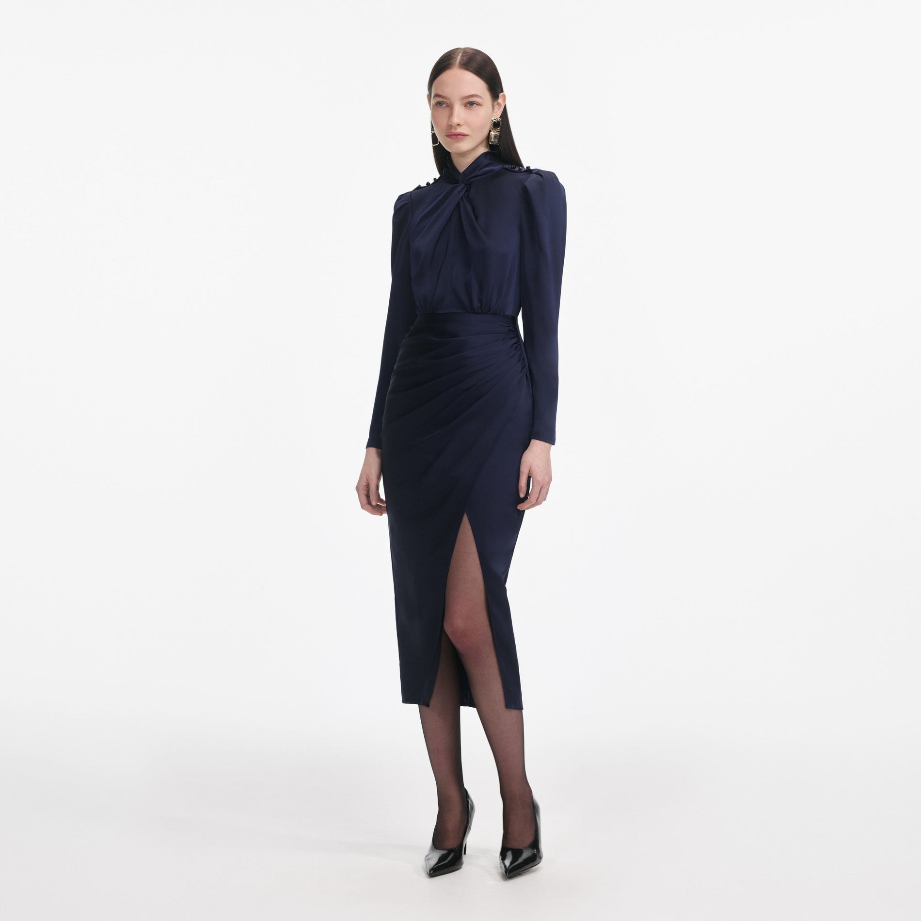 Side view of a woman wearing the Navy Satin Midi Dress