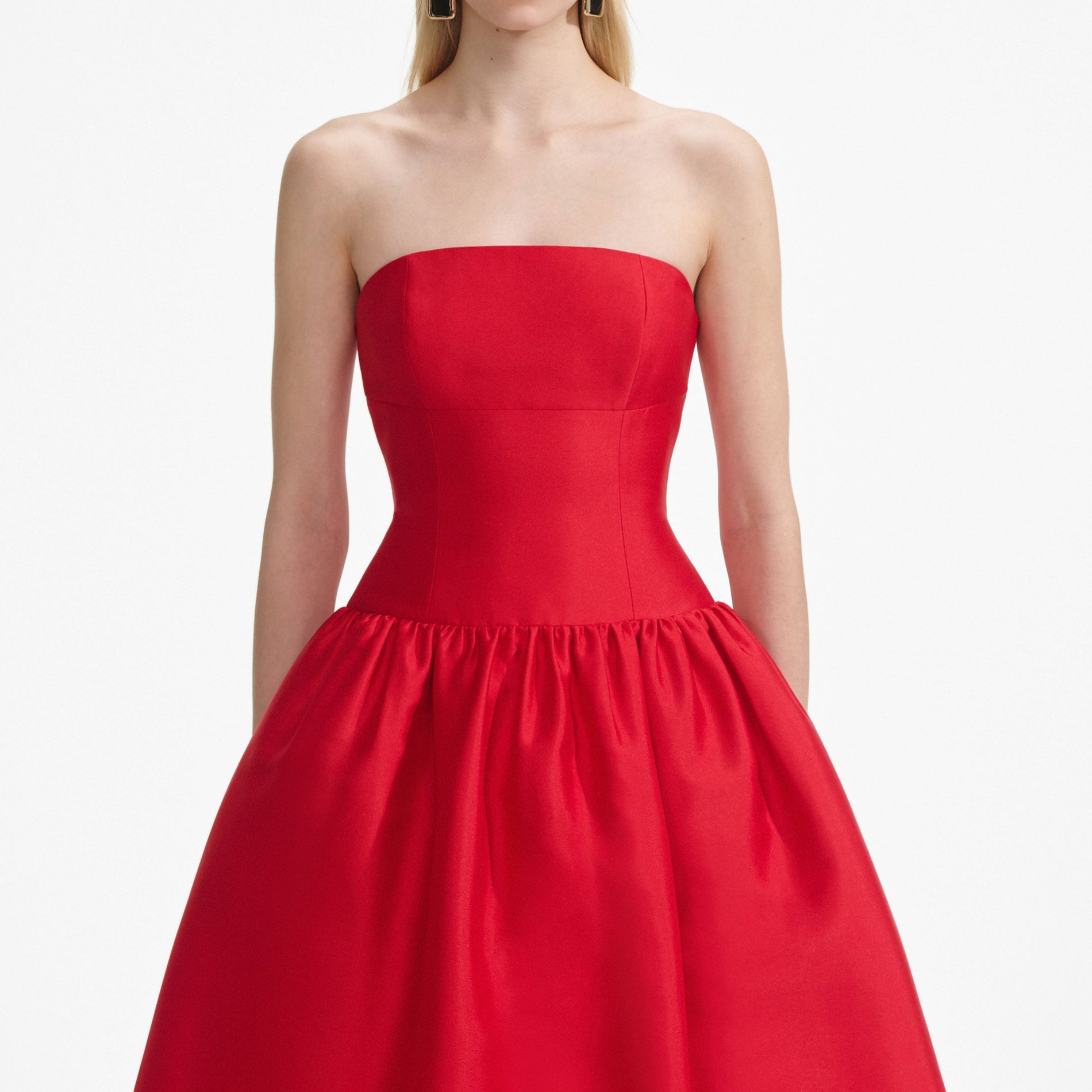 A close up of a woman wearing the Red Taffeta Midi Dress