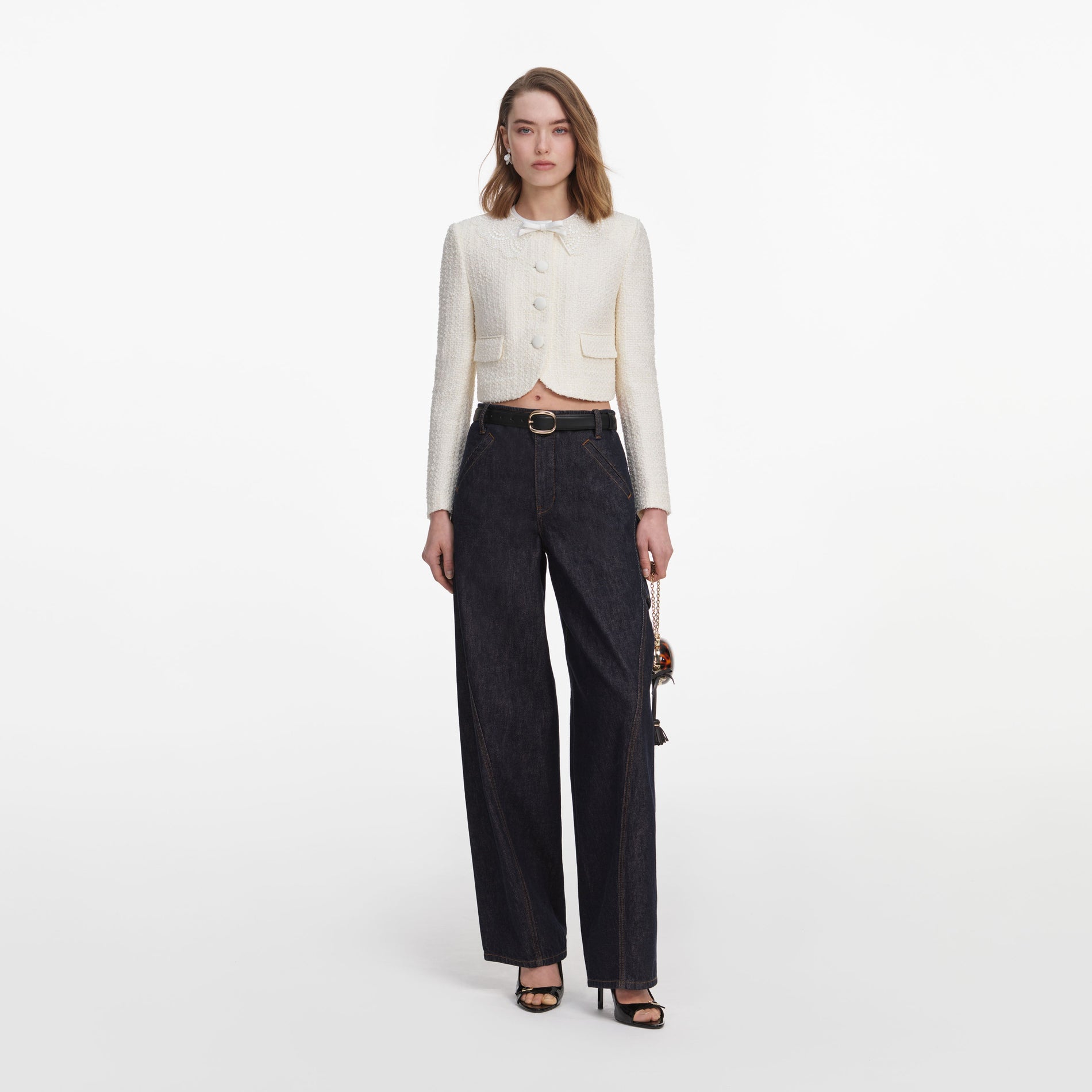 Front view of a woman wearing the Cream Boucle Lace Collar Jacket