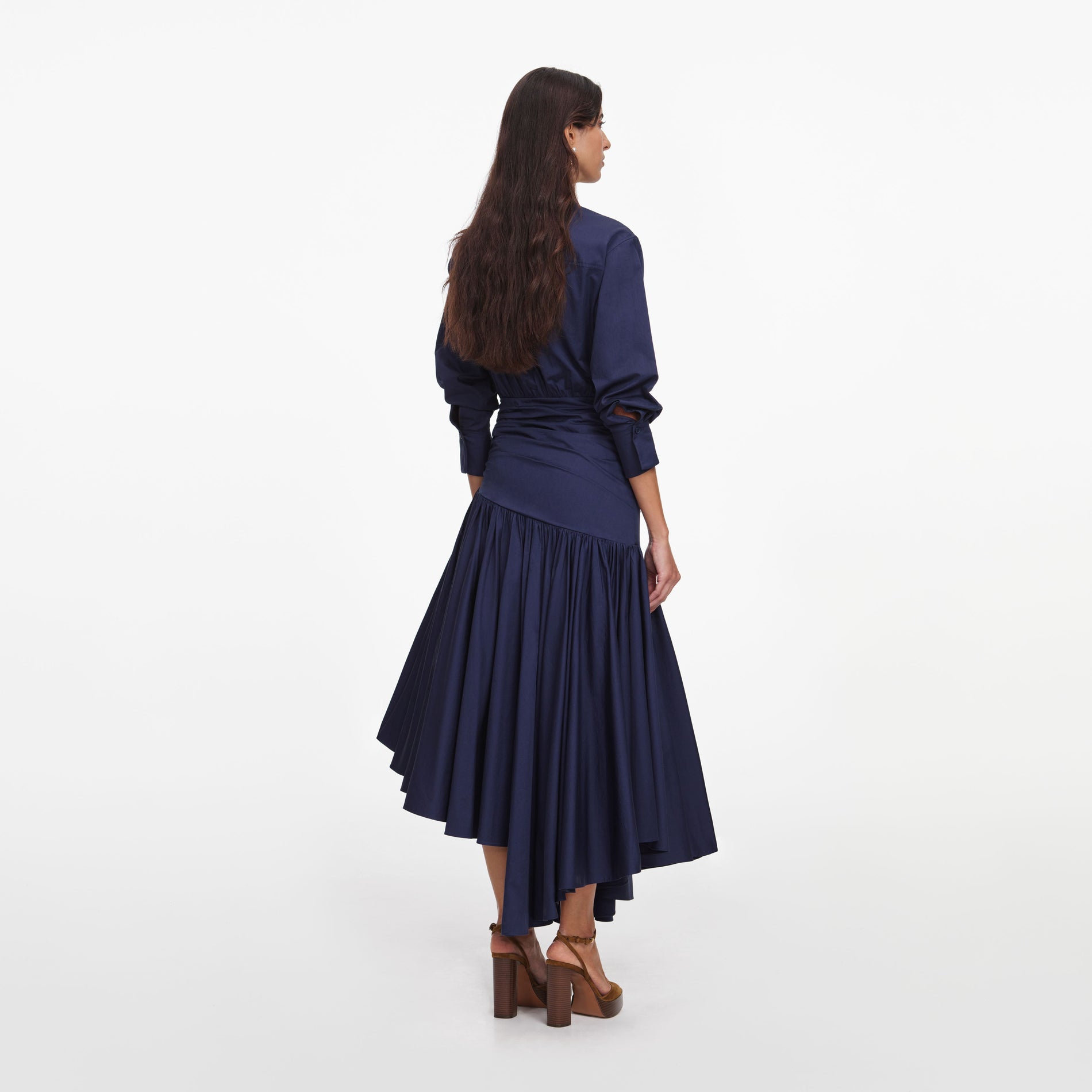 Back view of a woman wearing the Navy Cotton Asymmetric Midi Dress