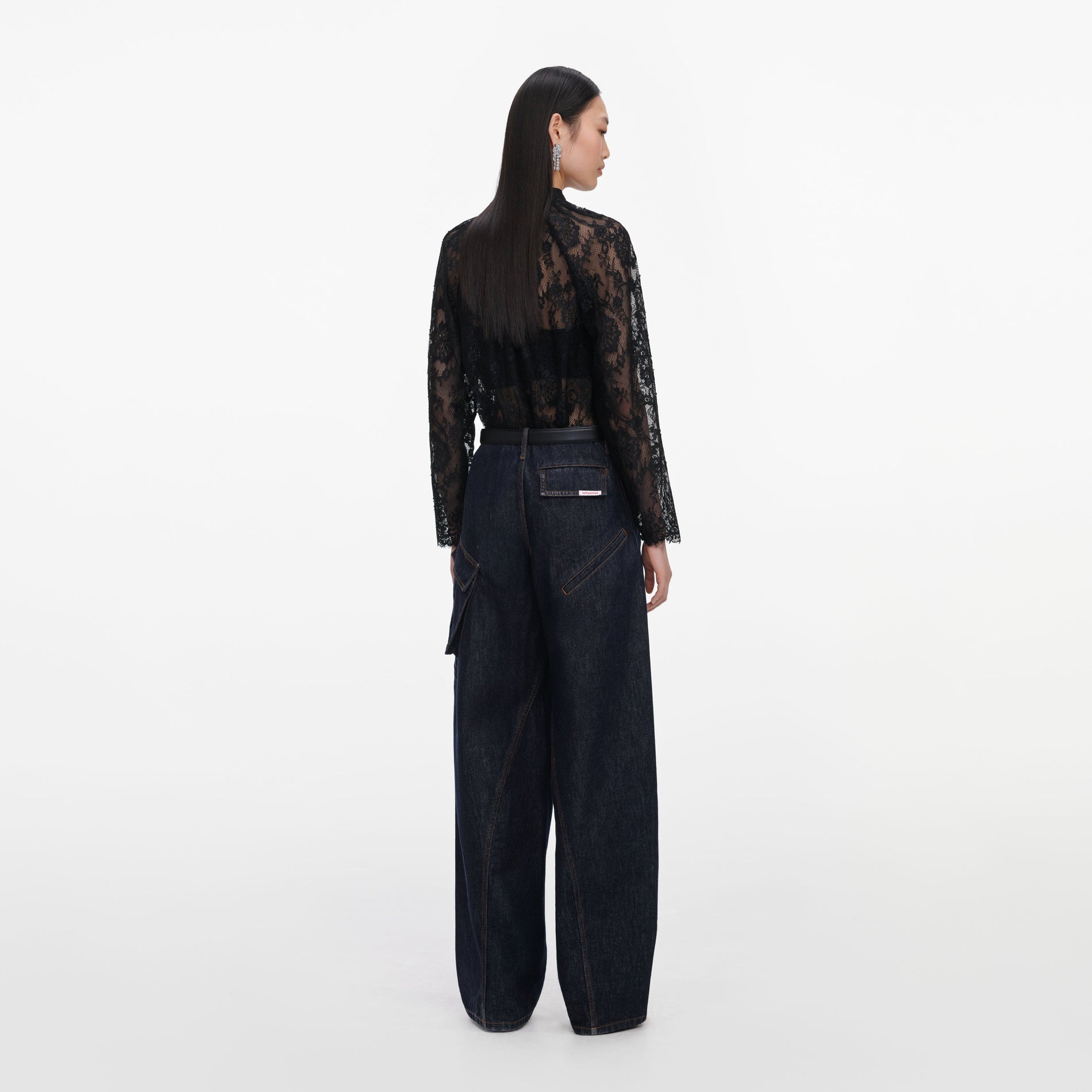 Back view of a woman wearing the Black Lace Blouse