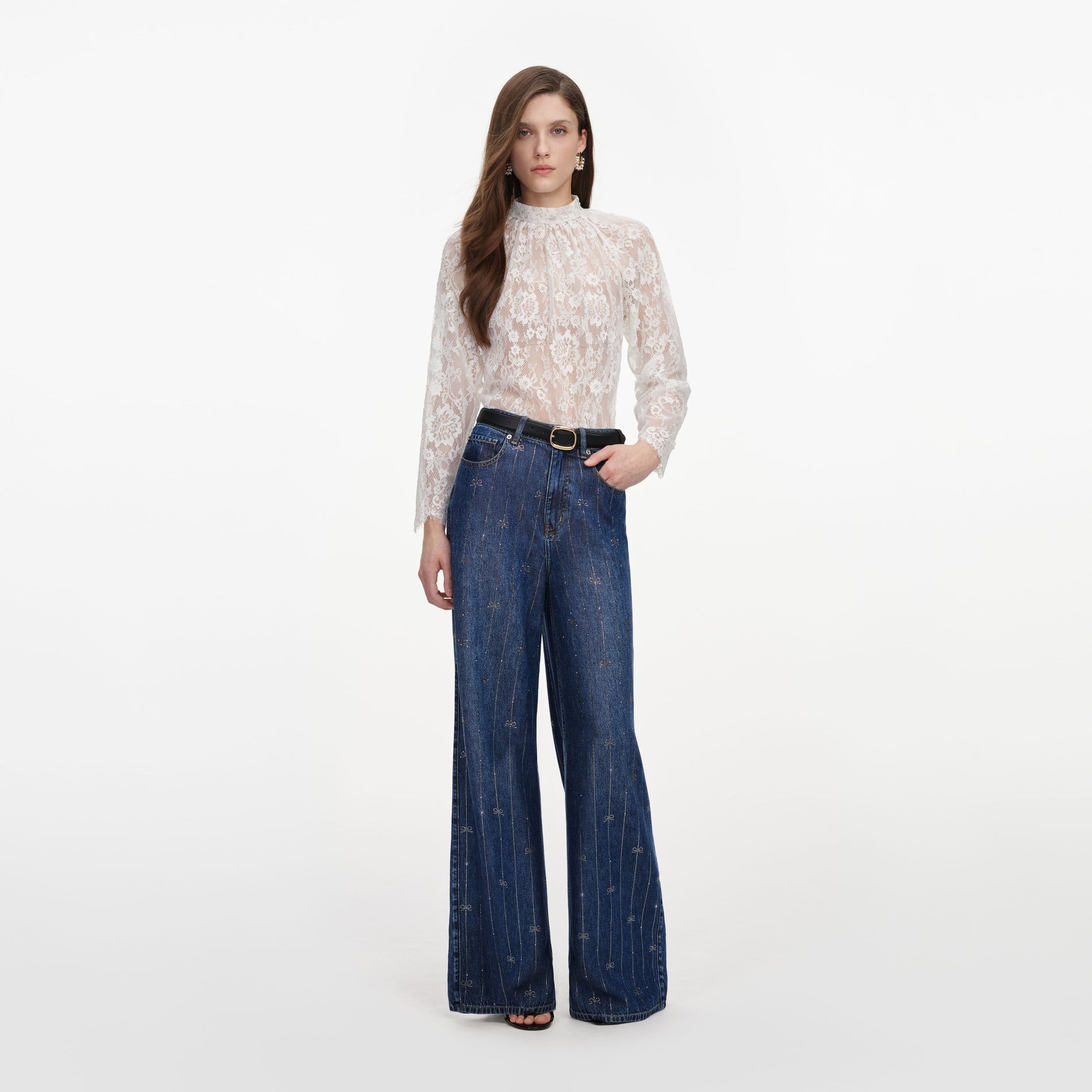 Front view of a woman wearing the Rhinestone Stripe Denim Jeans