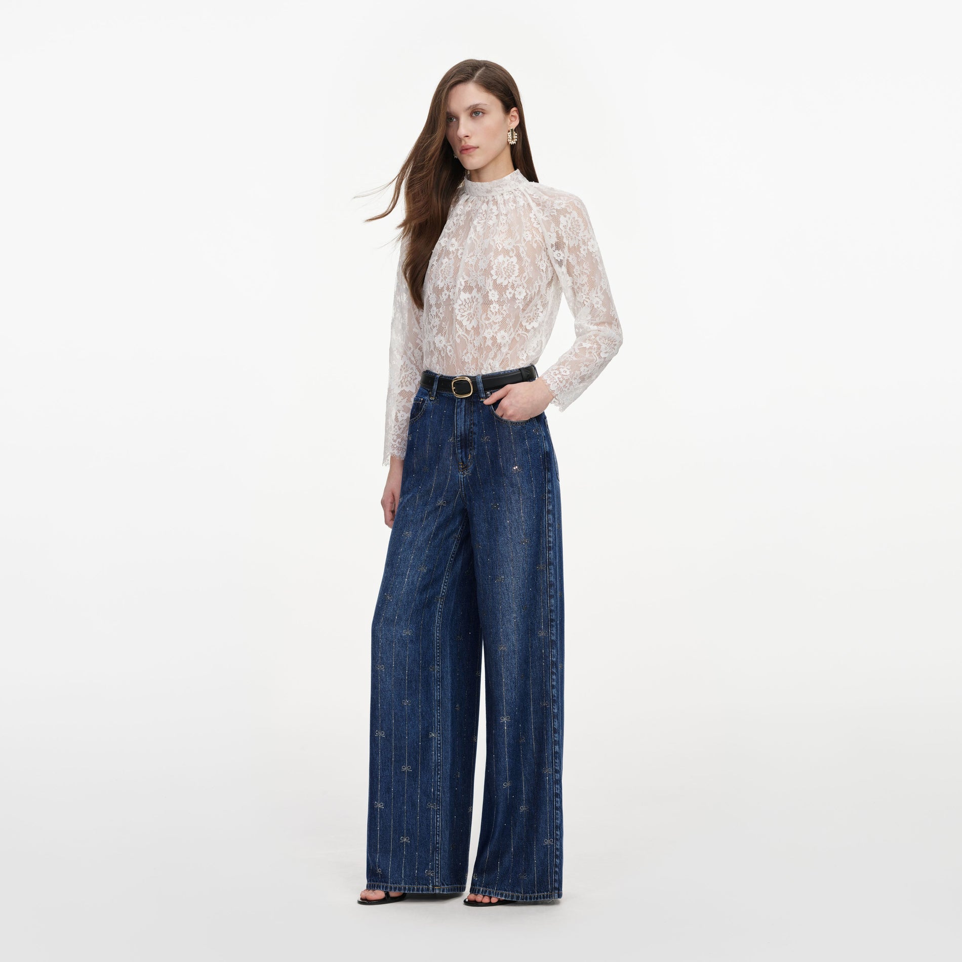 Side view of a woman wearing the Rhinestone Stripe Denim Jeans