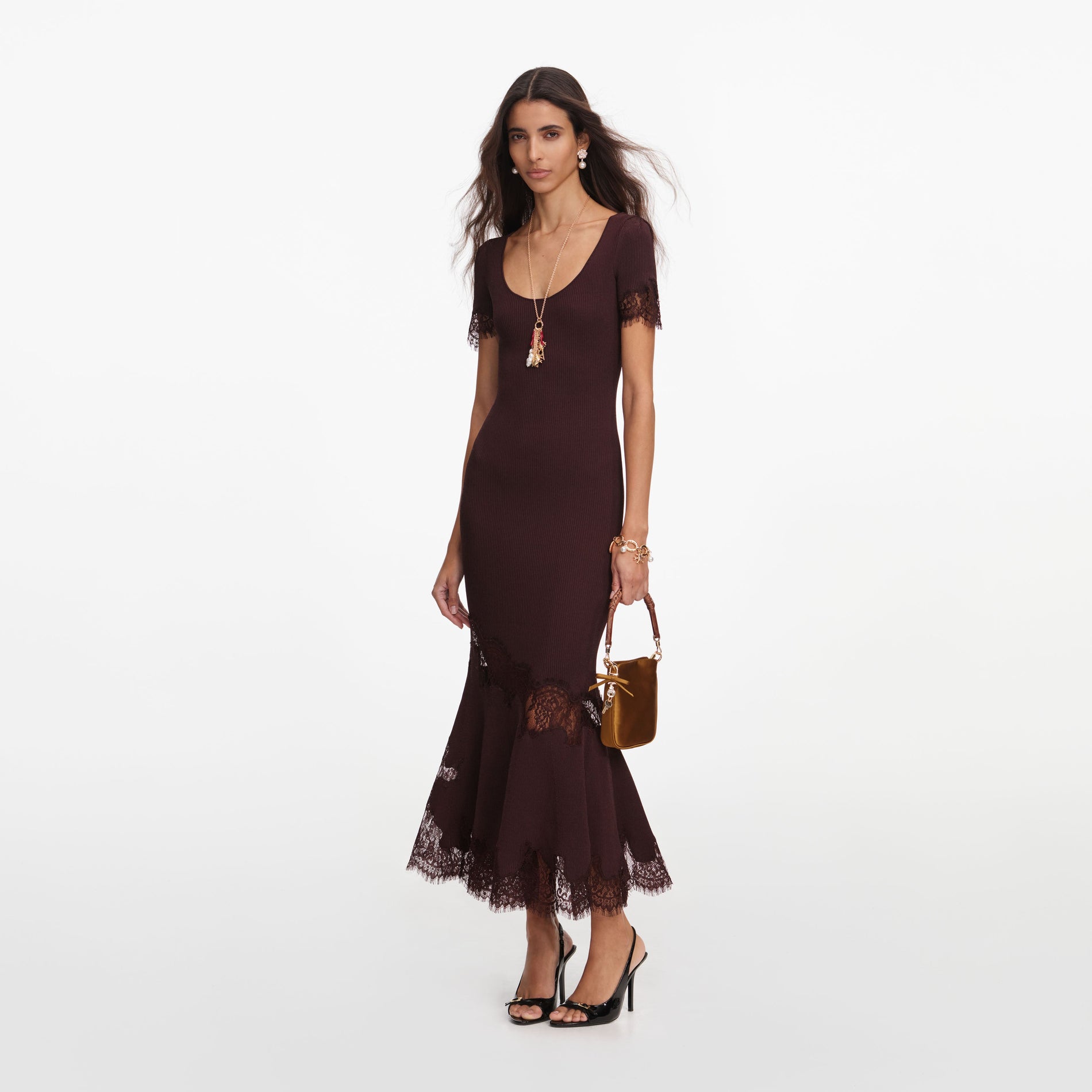 Side view of a woman wearing the Brown Ribbed Knit Midi Dress