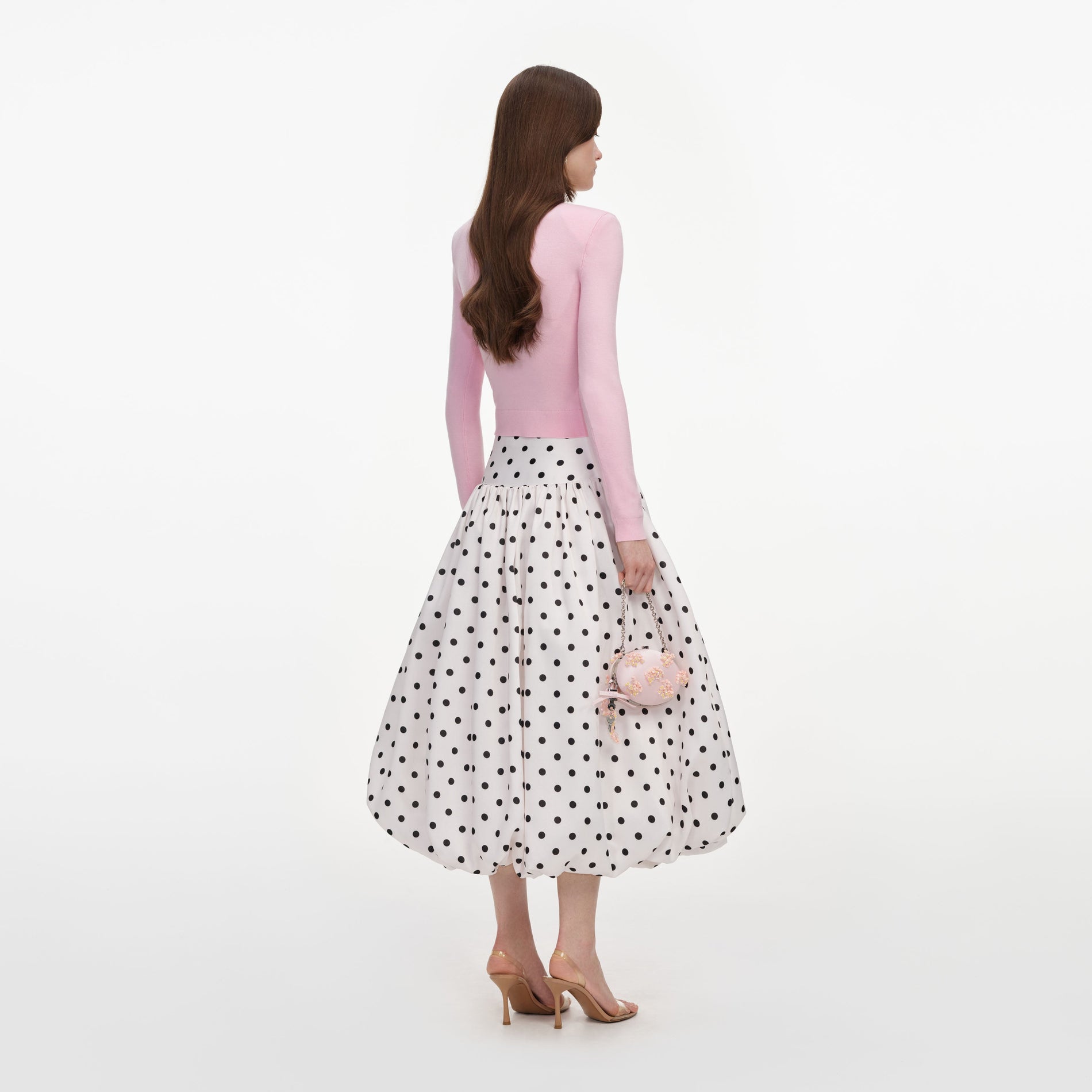 Back view of a woman wearing the Pink Flower Knit Jumper