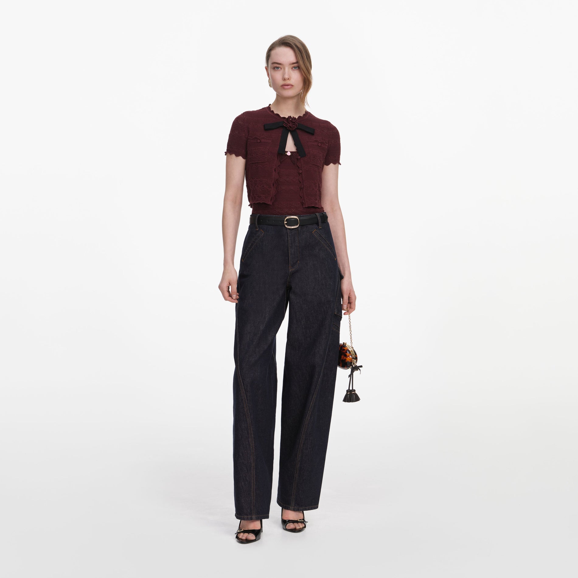 Front view of a woman wearing the Brown Pointelle Knit Top