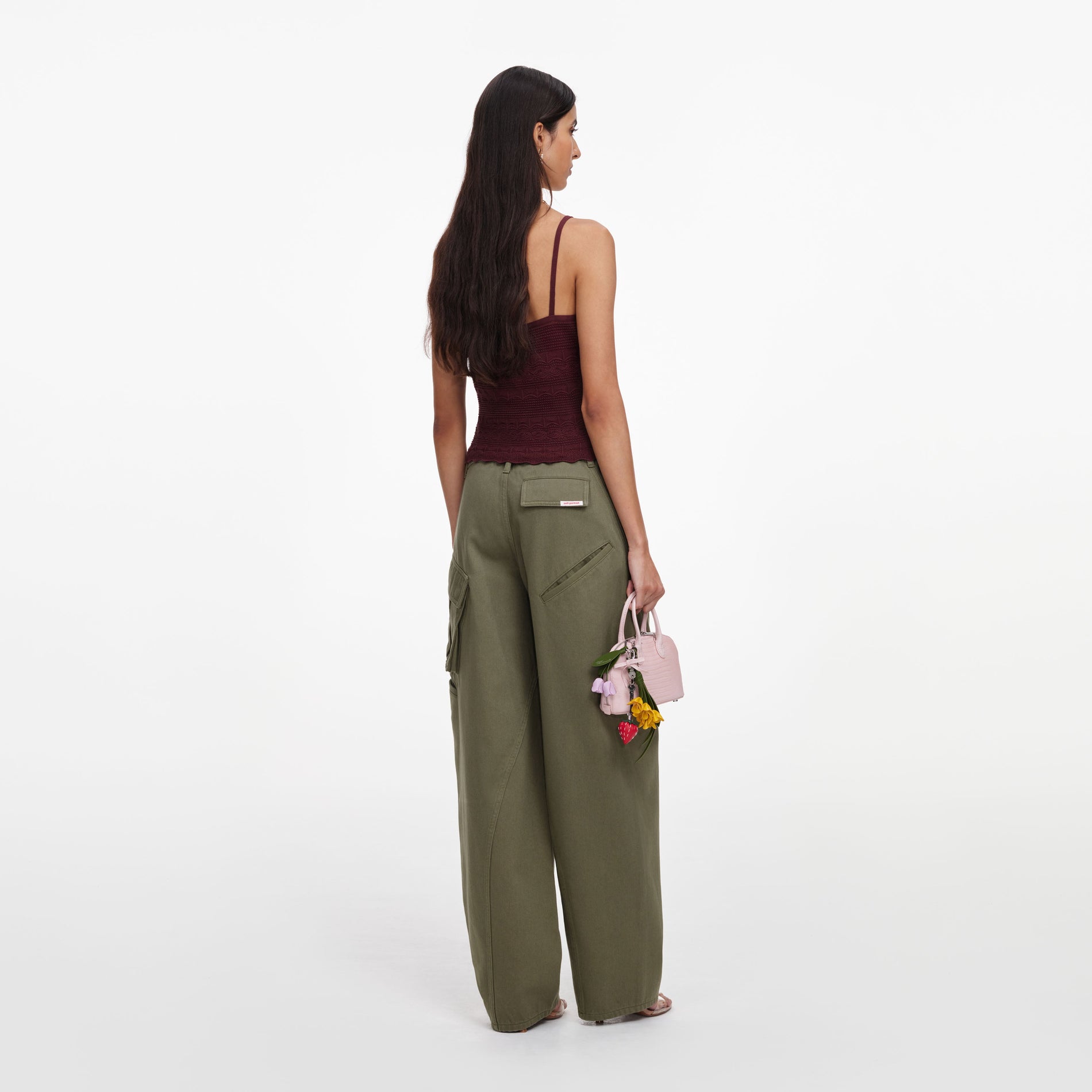 Back view of a woman wearing the Brown Pointelle Knit Vest