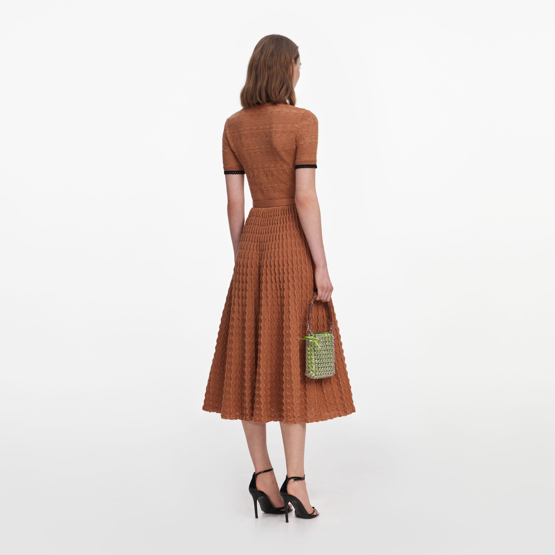 Back view of a woman wearing the Brown Pointelle Knit Midi Dress