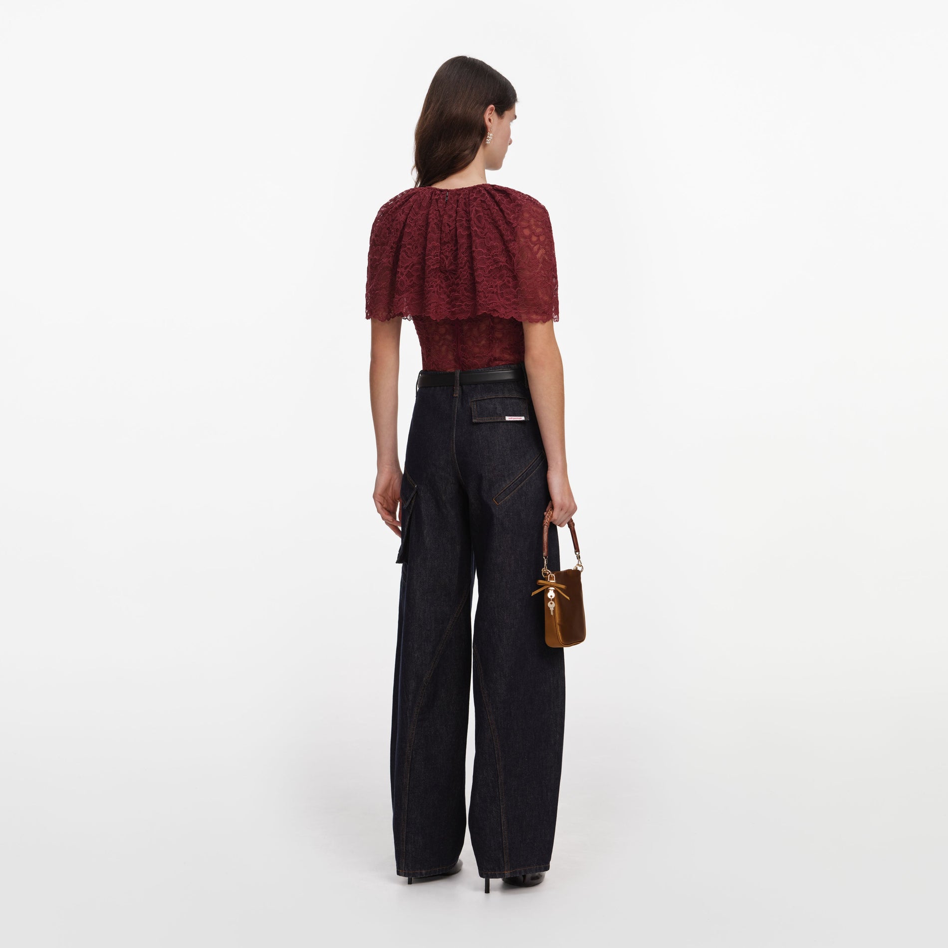 Back view of a woman wearing the Burgundy Lace Cape Top