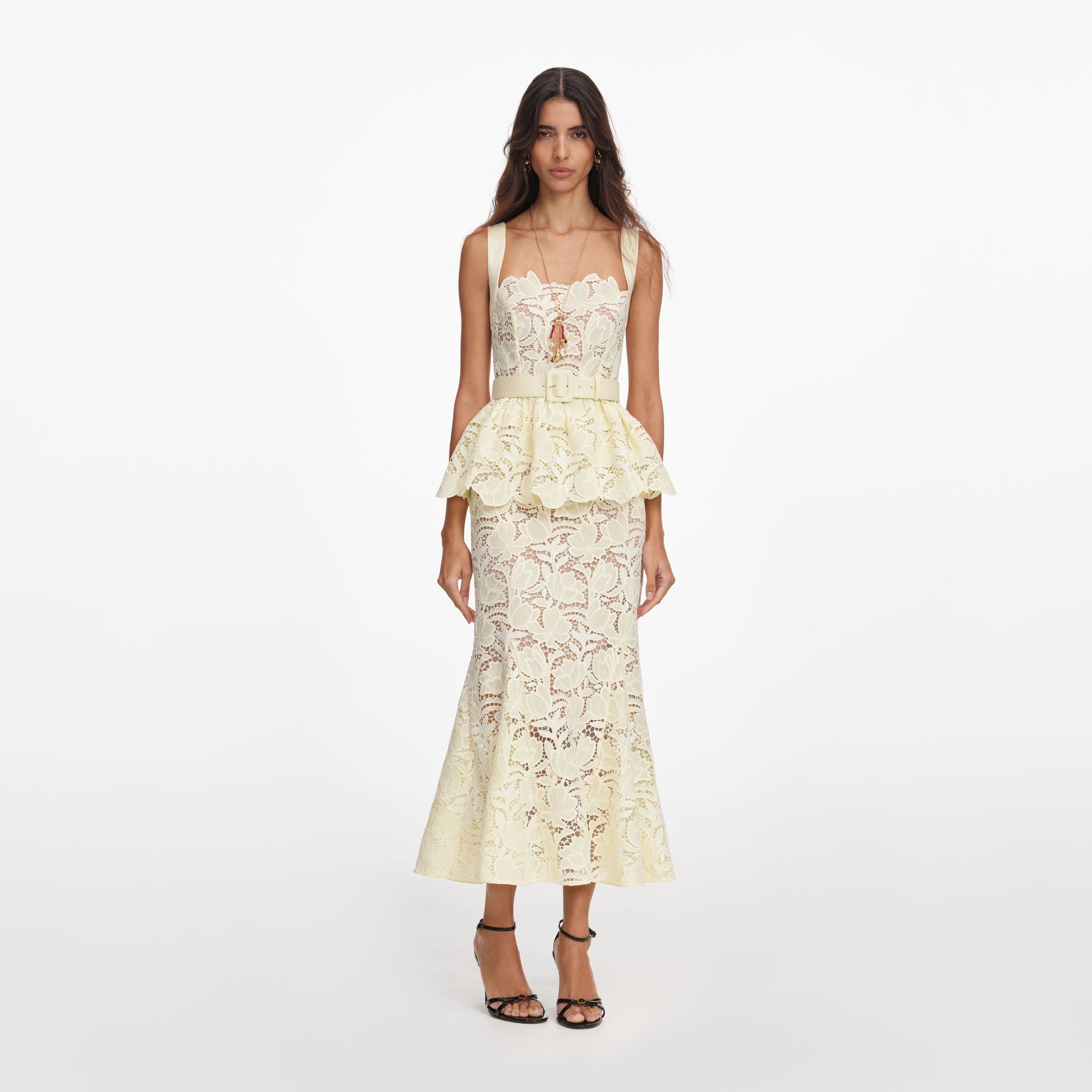 Front view of a woman wearing the Yellow Lace Peplum Midi Dress
