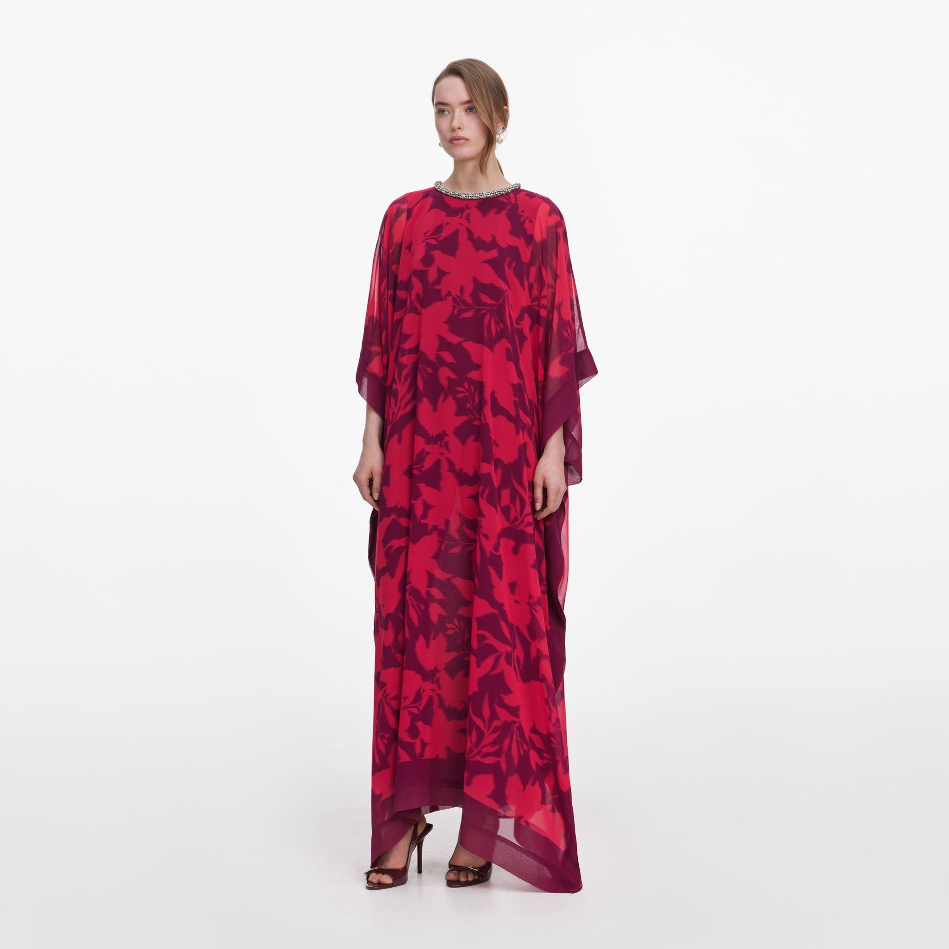 Side view of a woman wearing the Pink Floral Kaftan