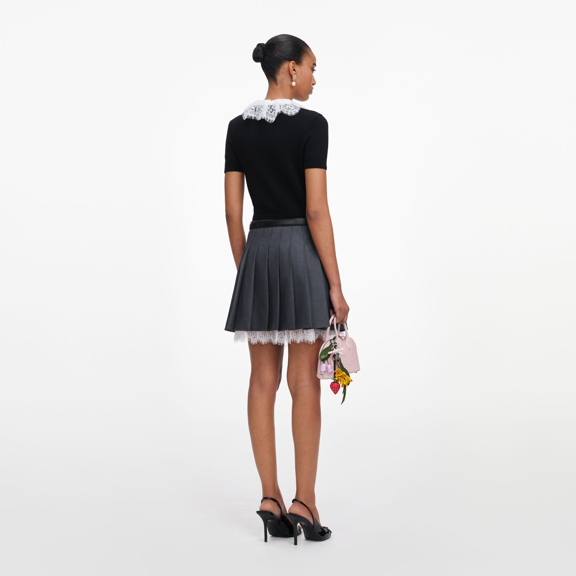 Back view of a woman wearing the Black Knit Lace Collar Top