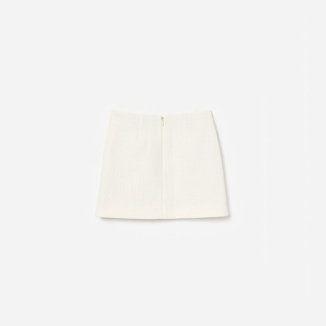 Cream tweed mini skirt with a back zipper