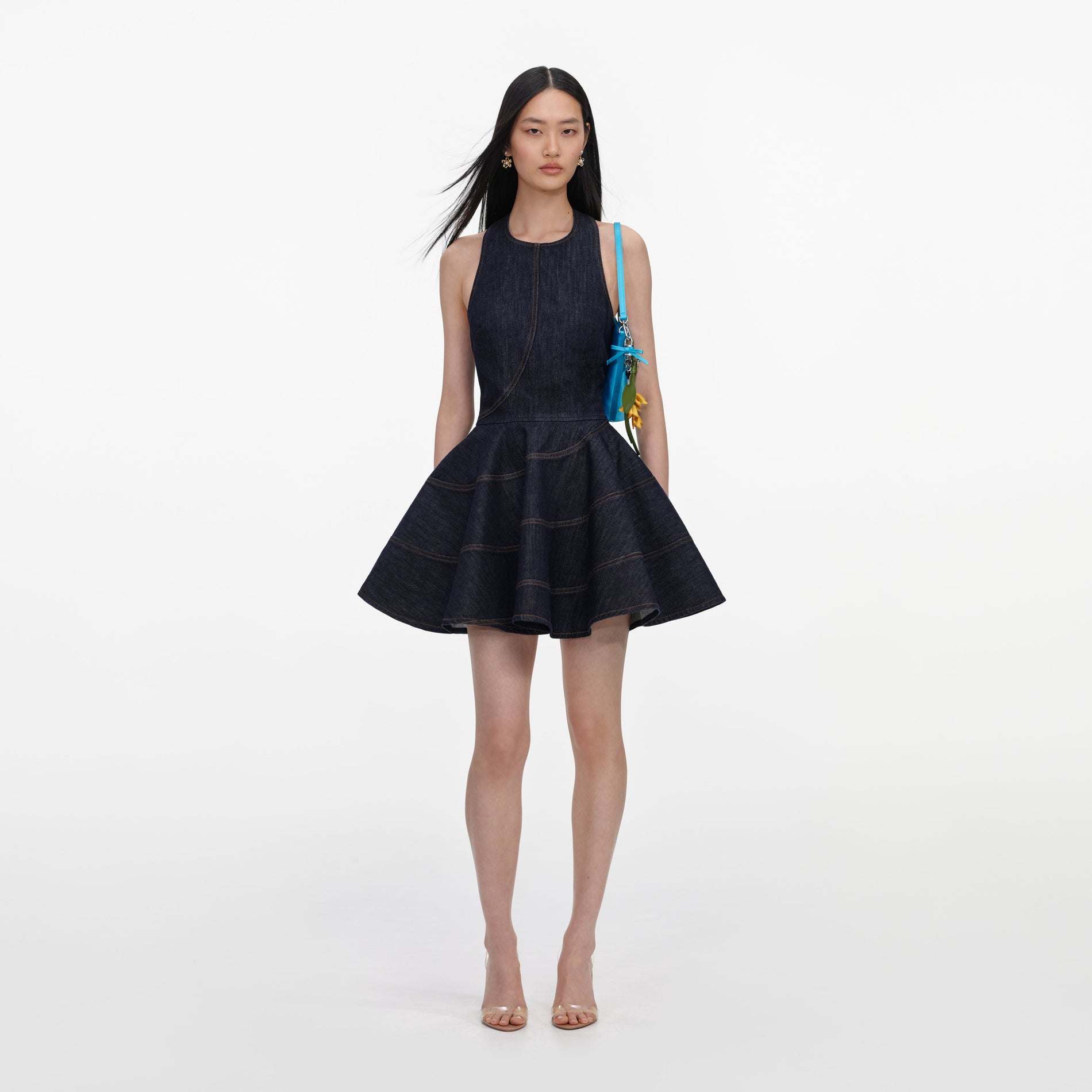 Front view of a woman wearing the Indigo Denim Halterneck Mini Dress