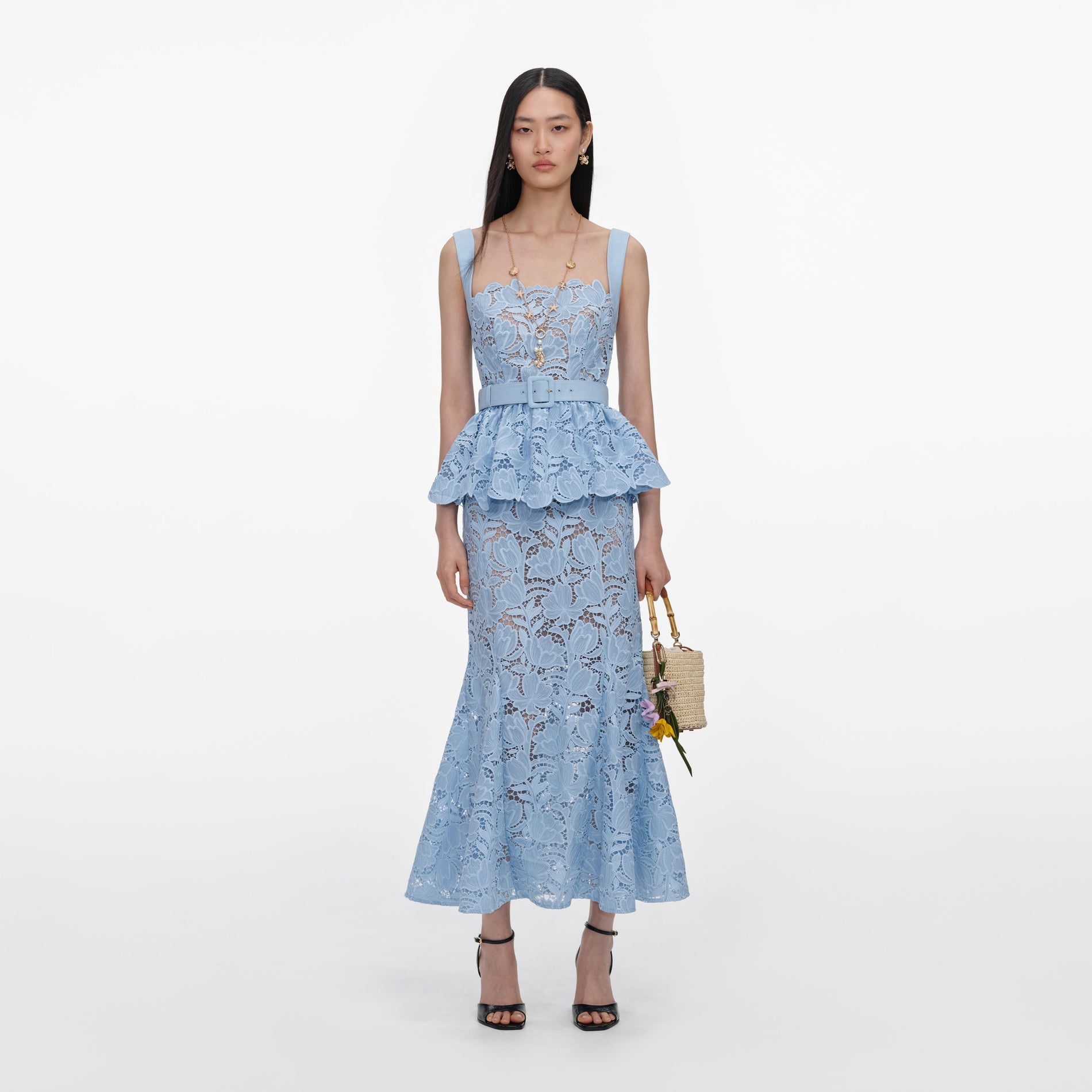 Front view of a woman wearing the Blue Lace Peplum Midi Dress