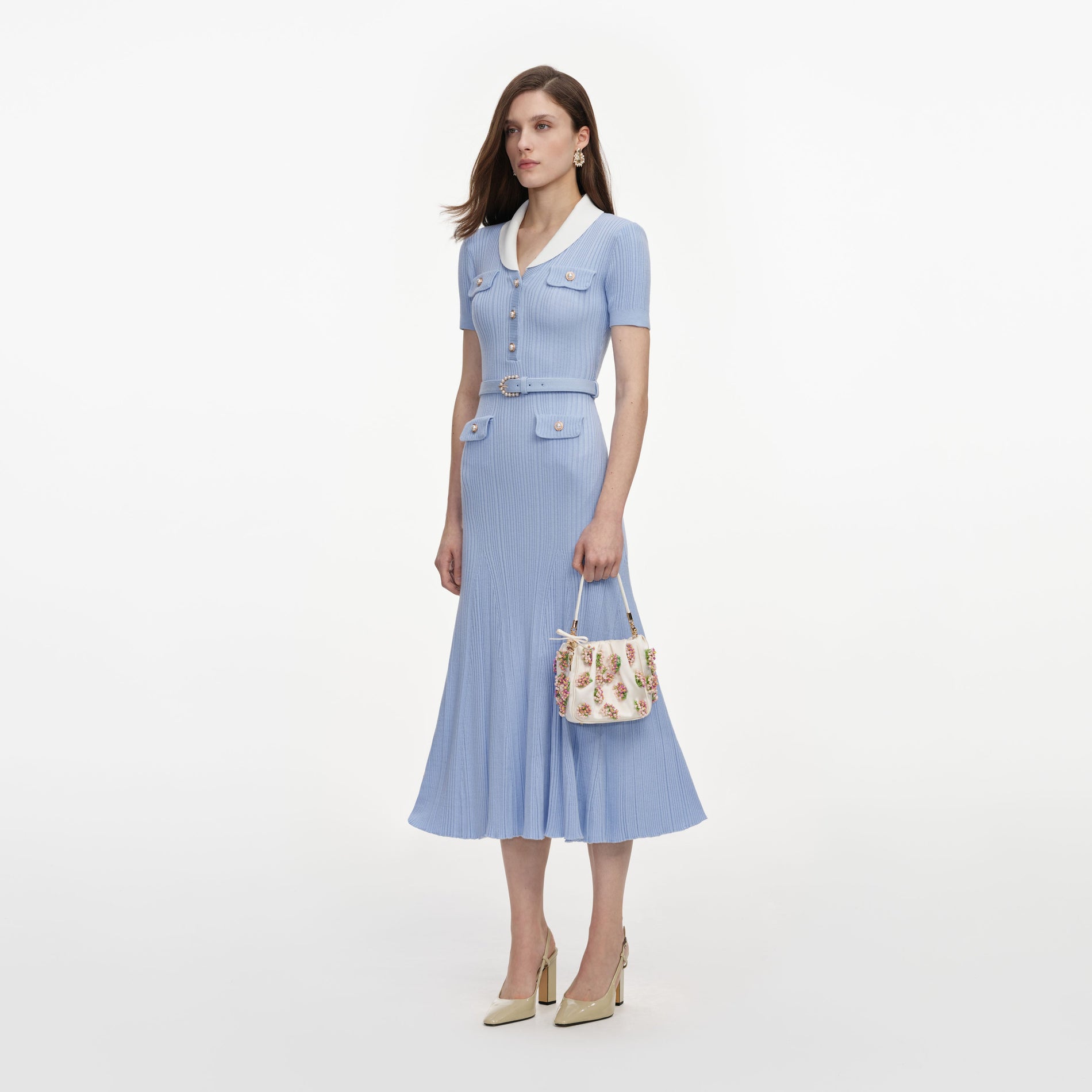 Side view of a woman wearing the Blue Ribbed Knit Midi Dress