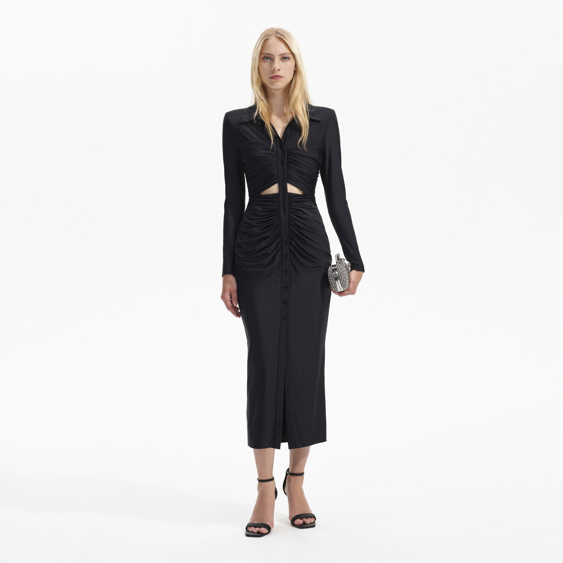 Front view of a woman wearing the Black Jersey Ruched Cut Out Midi Dress