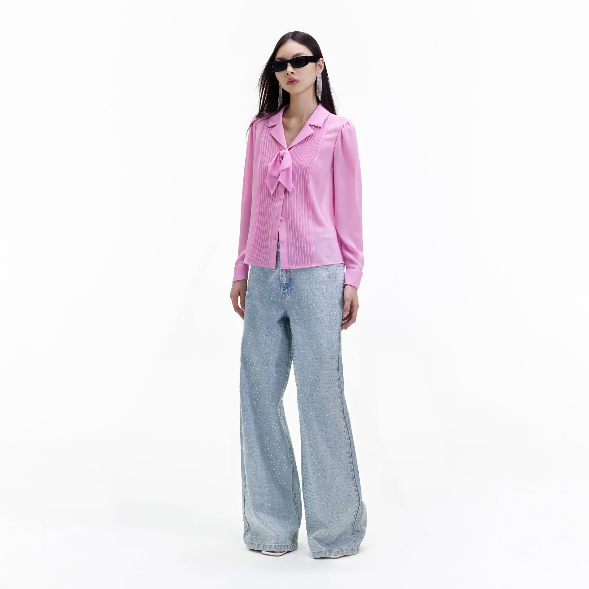 Side view of a woman wearing the Pink Chiffon Blouse