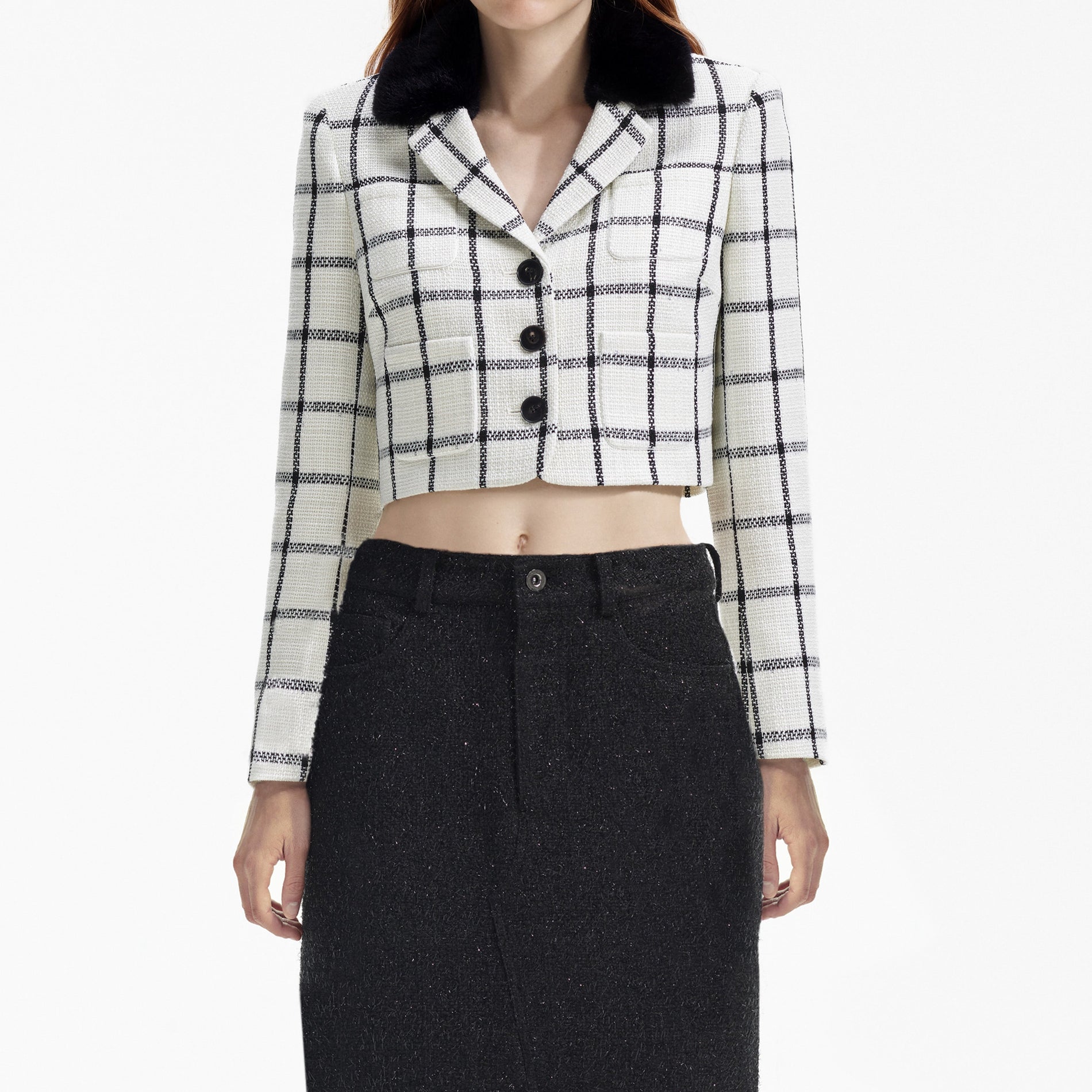 A close up of a woman wearing the Cream Check Jacket