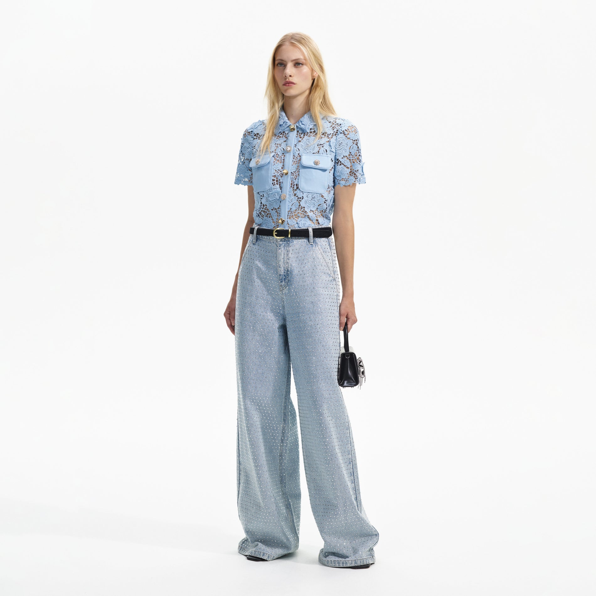 Side view of a woman wearing the Blue Lace Collar Top