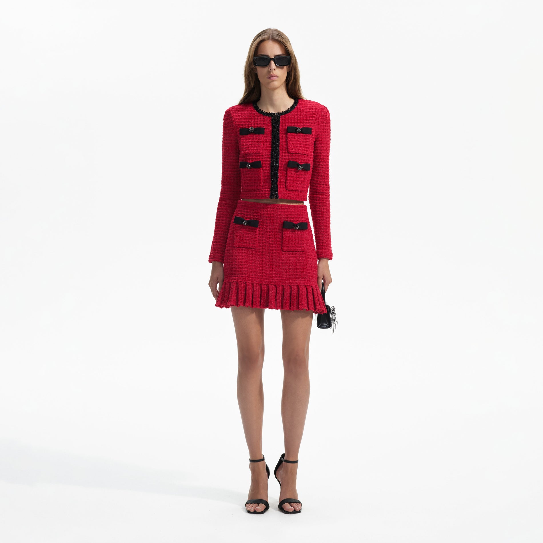 Front view of a woman wearing the Red Knit Mini Skirt