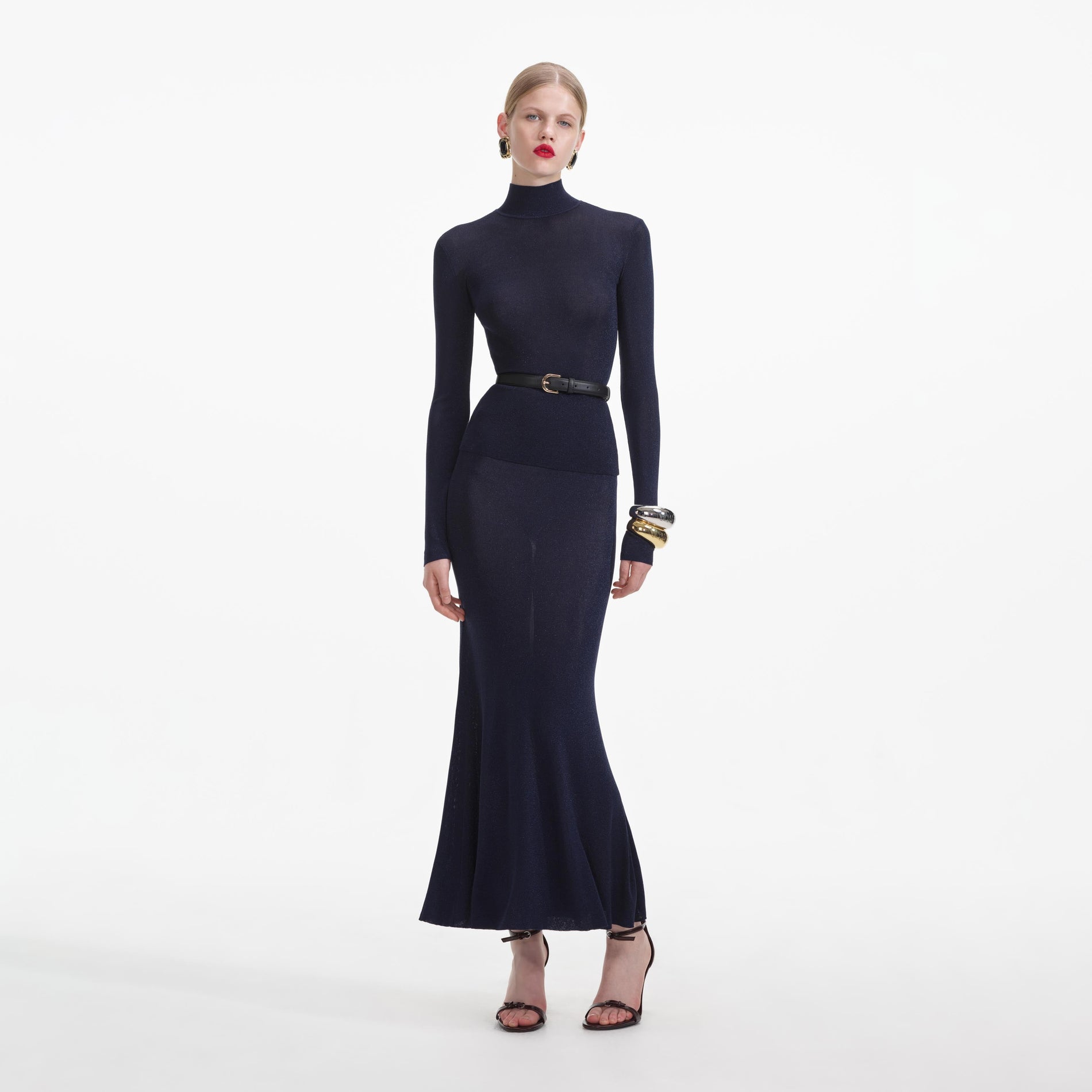 Front view of a woman wearing the Navy Viscose Knit Top