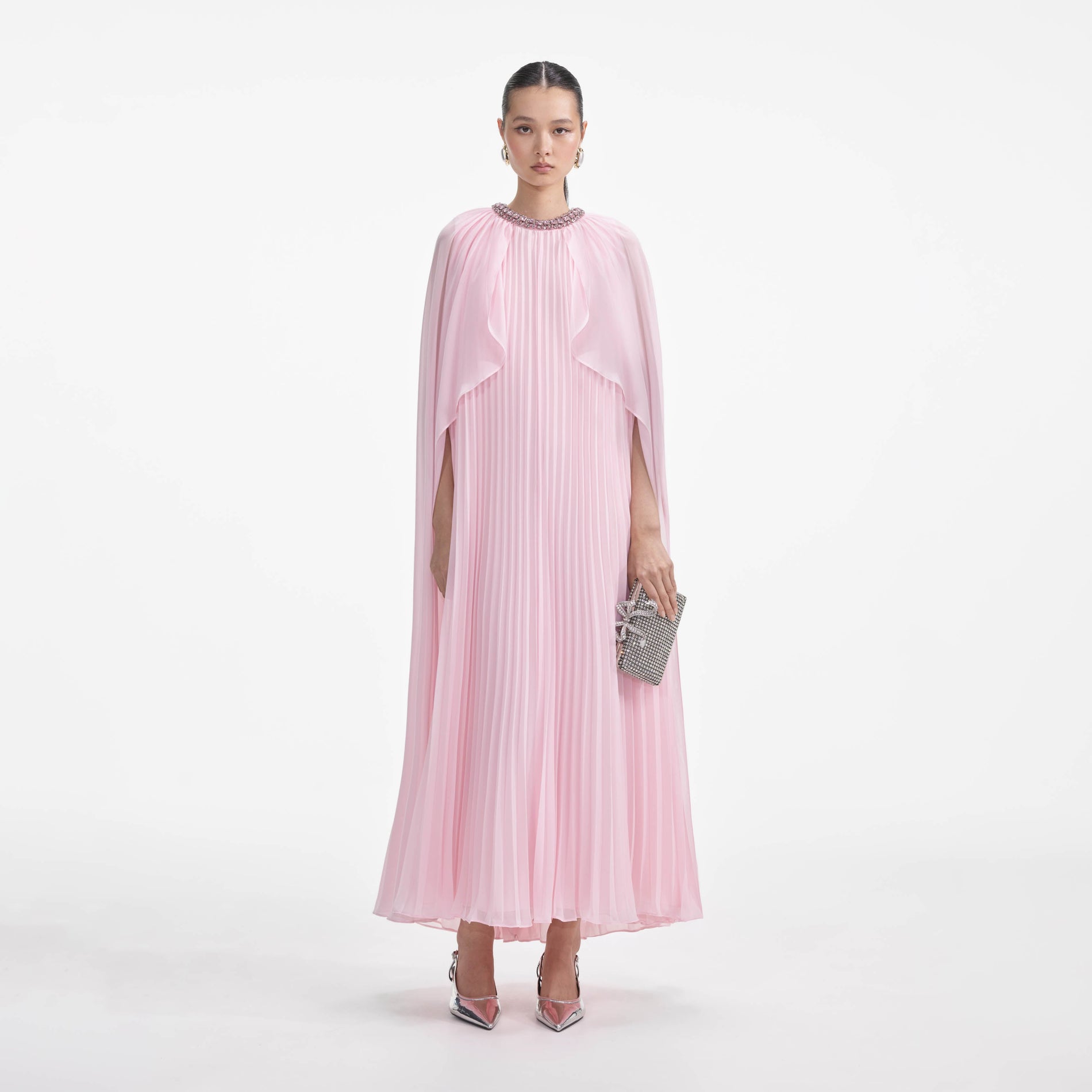 Front view of a woman wearing the Pink Chiffon Cape Midi Dress
