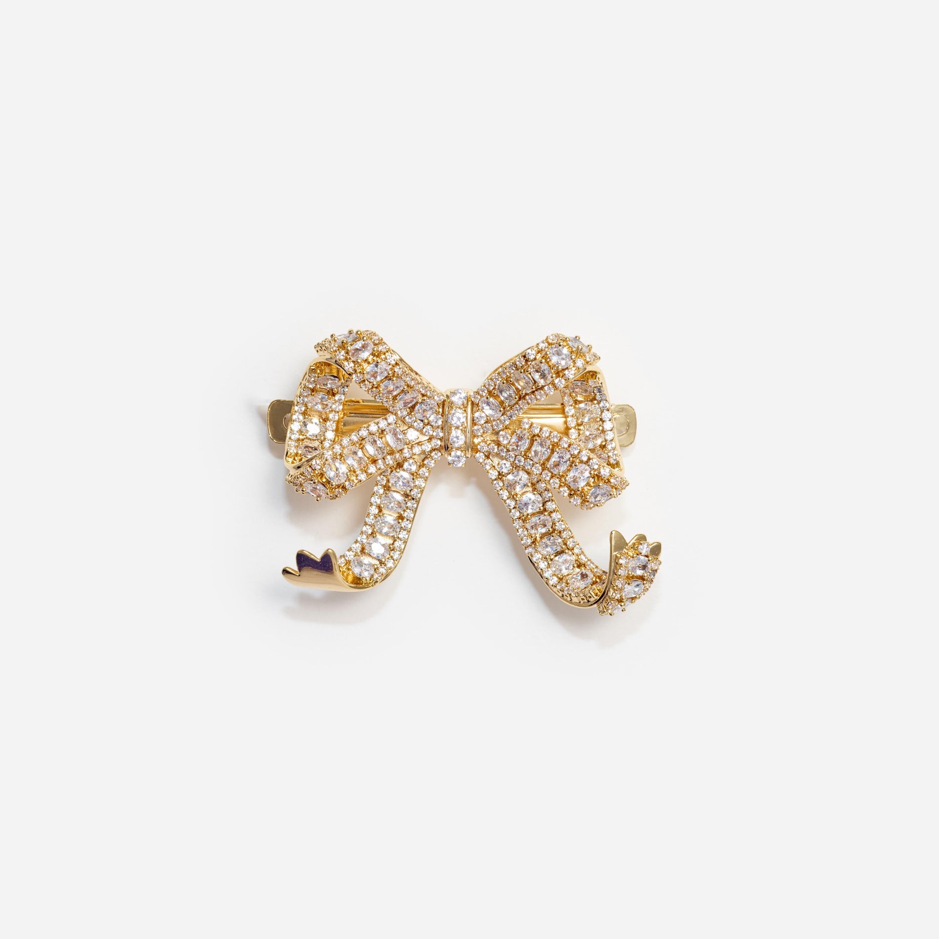 Front view of a woman wearing the Gold Crystal Bow Hair Clip