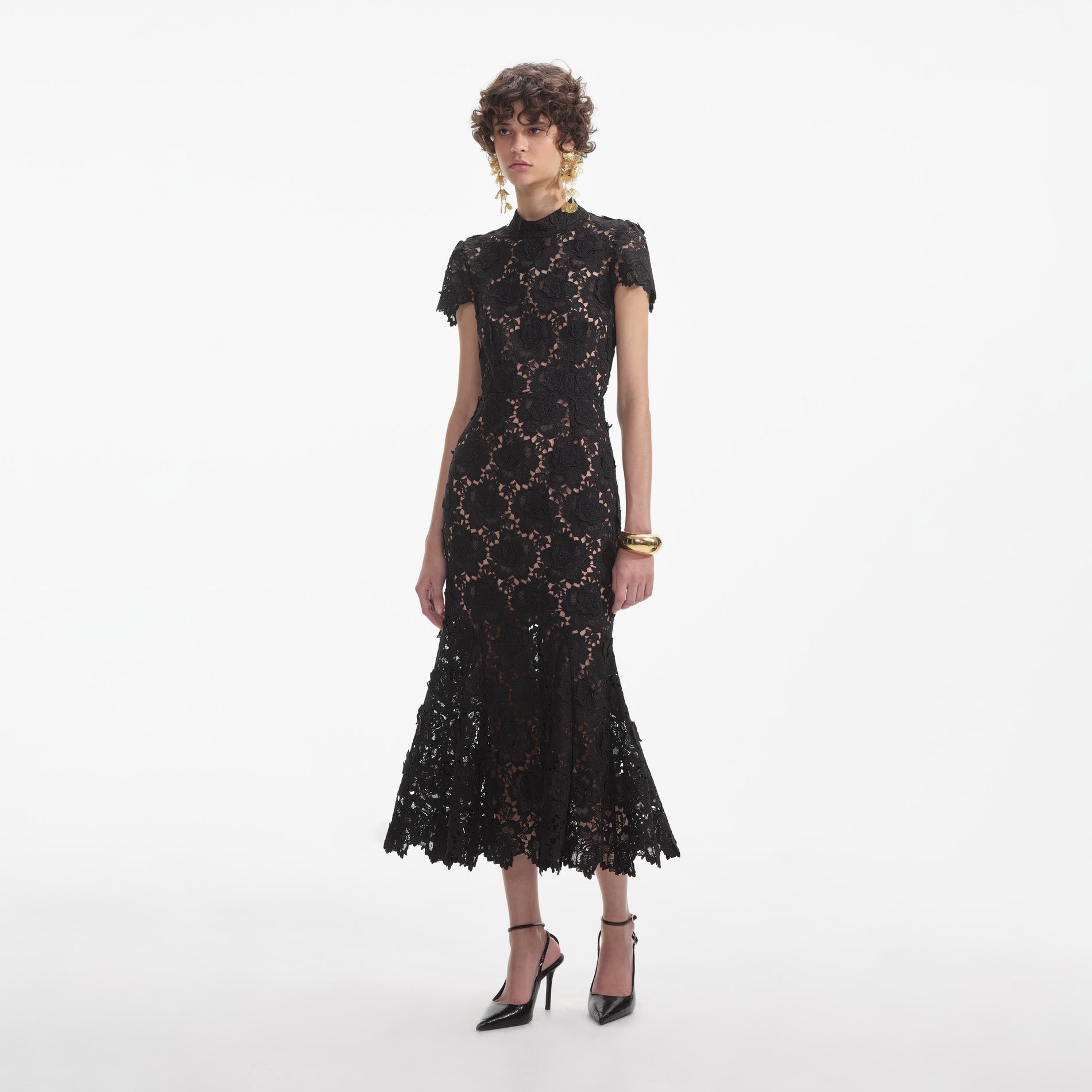 Side view of a woman wearing the Black Flower Lace Midi Dress