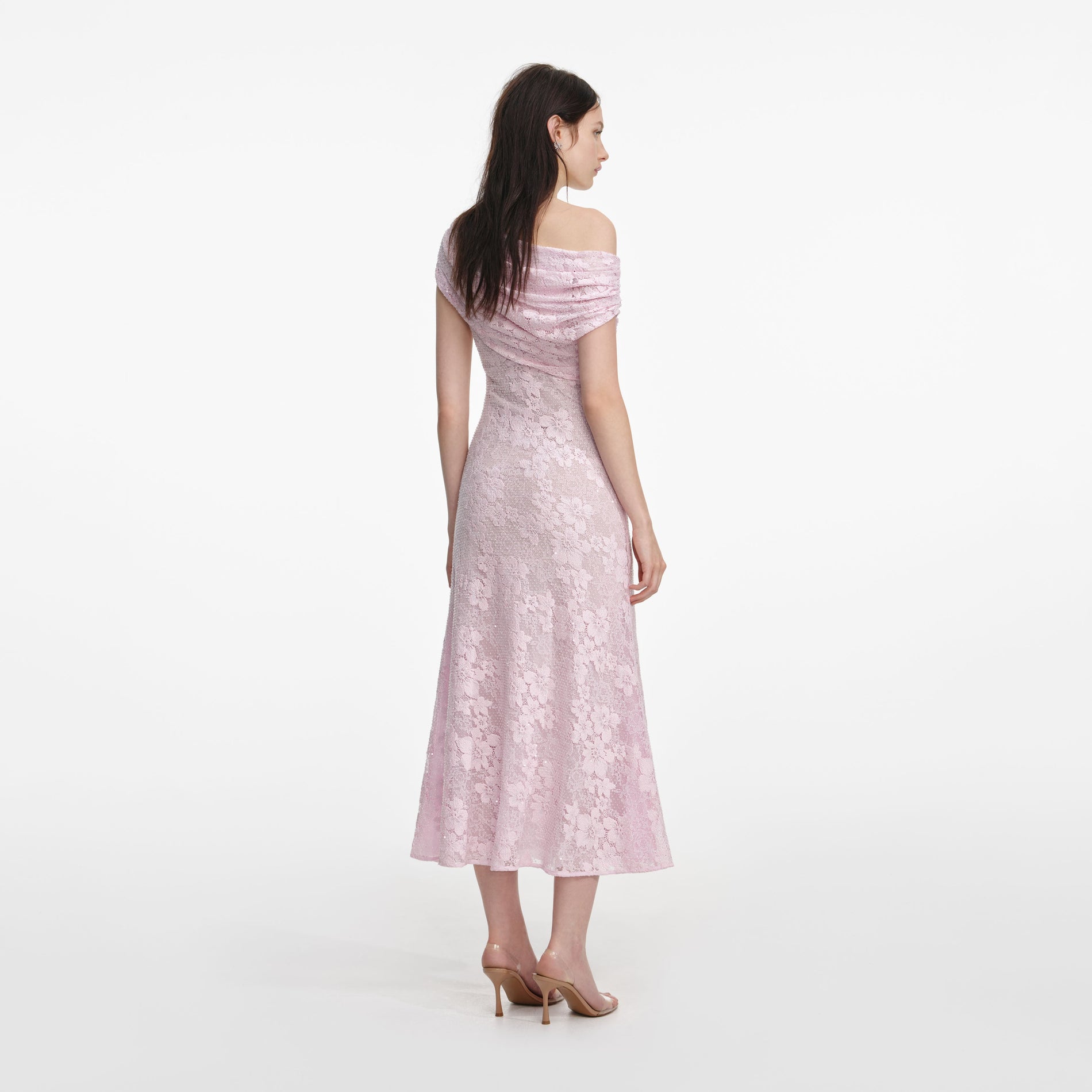 Back view of a woman wearing the Pink Rhinestone Lace Asymmetric Midi Dress