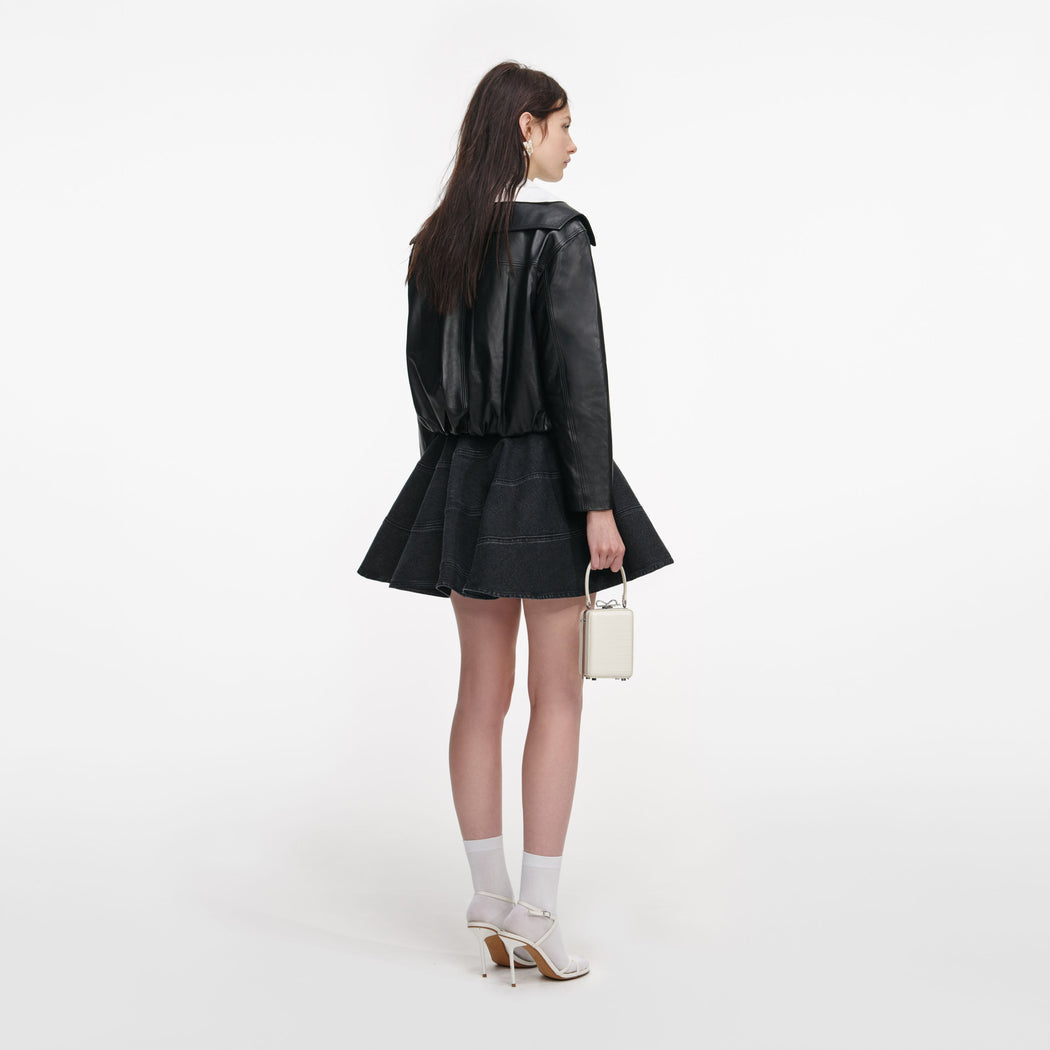Back view of a woman wearing the Black Leather Contrast Collar Jacket