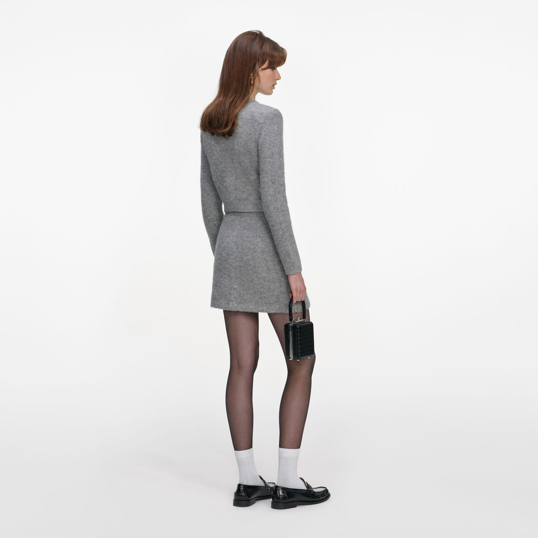 Back view of a woman wearing the Grey Fluffy Knit Mini Skirt