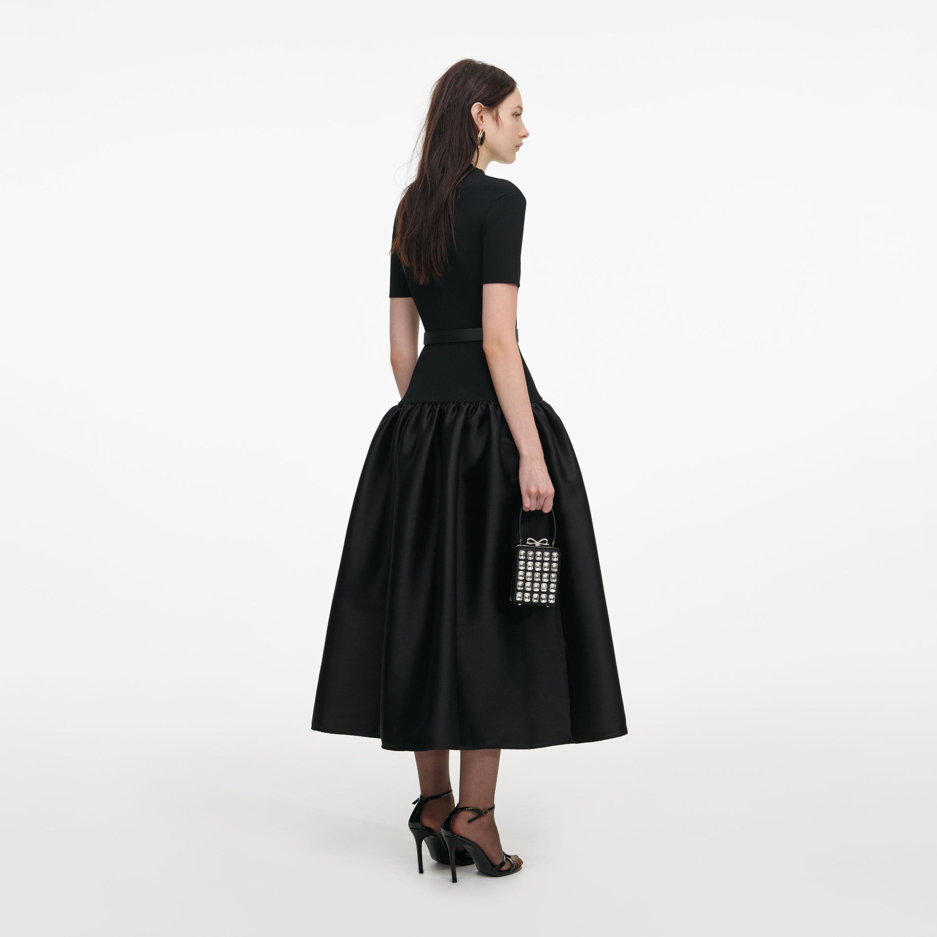 Back view of a woman wearing the Black Knit Taffeta Midi Dress