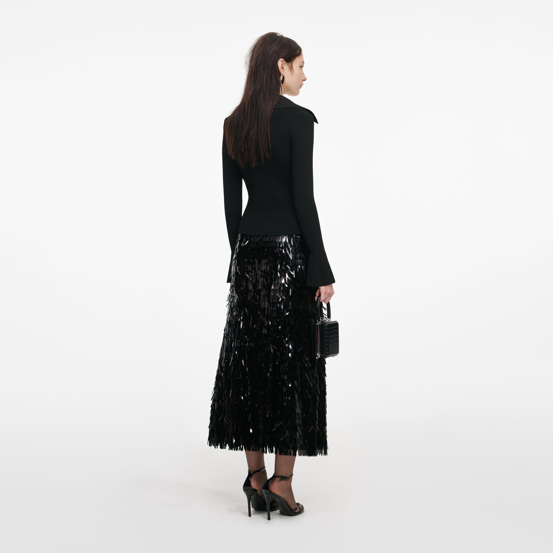Back view of a woman wearing the Black Button Down Knit Top