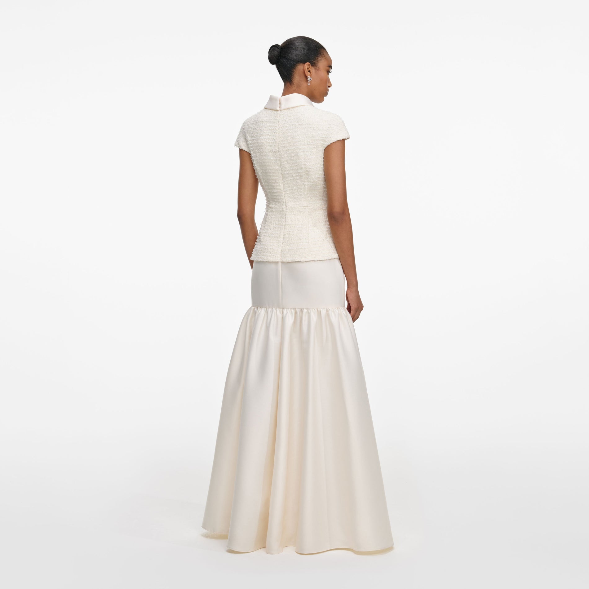 Back view of a woman wearing the Cream Boucle Taffeta Maxi Dress