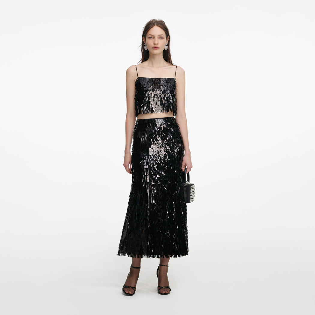 Front view of a woman wearing the Black Sequin Top